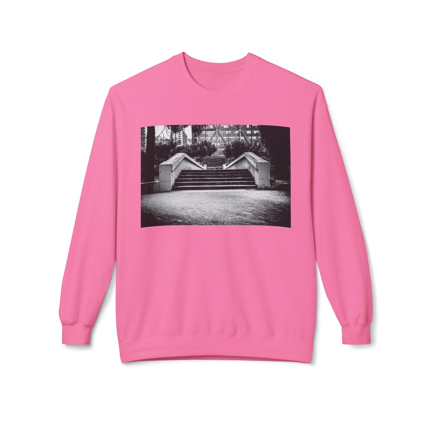 Front view of a pink long-sleeve sweatshirt.  The soft fabric drapes naturally, showcasing the relaxed fit. Ideal for layering or wearing solo, this piece adds a pop of color with a skate-inspired edge."