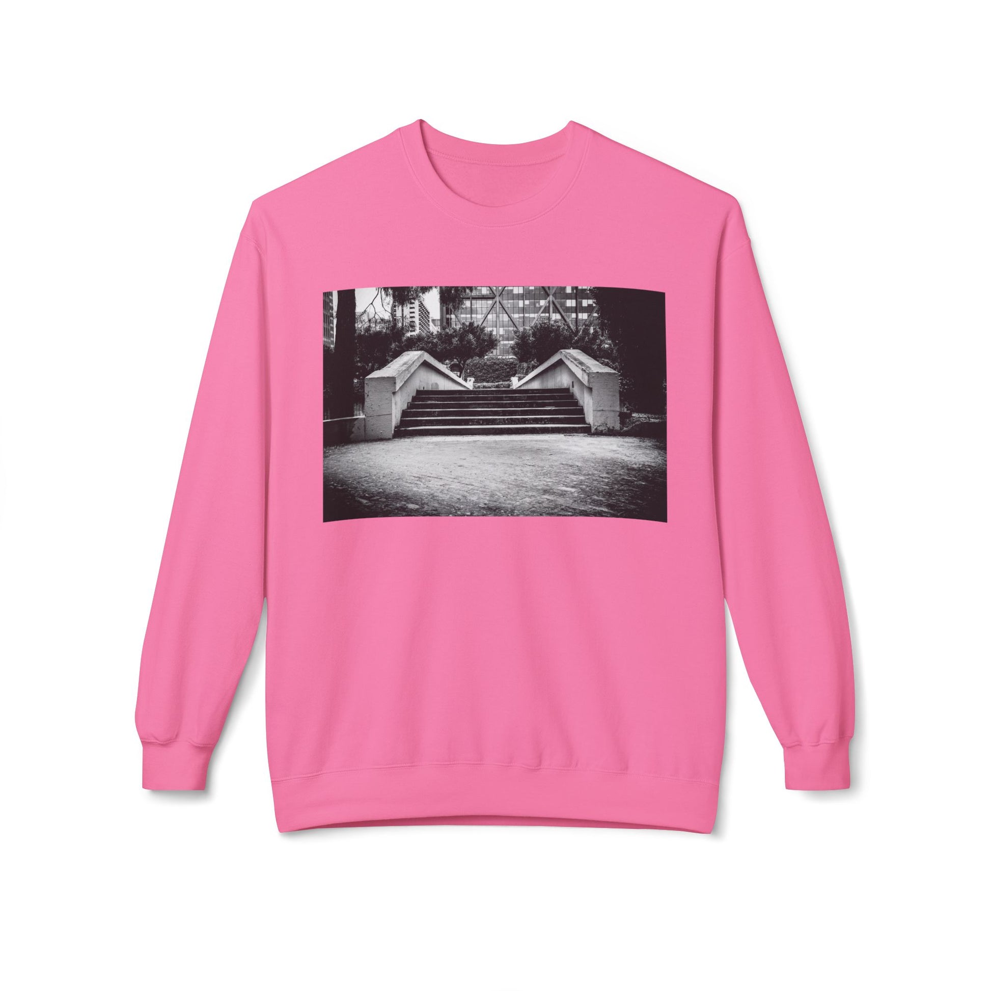Front view of a pink long-sleeve sweatshirt.  The soft fabric drapes naturally, showcasing the relaxed fit. Ideal for layering or wearing solo, this piece adds a pop of color with a skate-inspired edge."