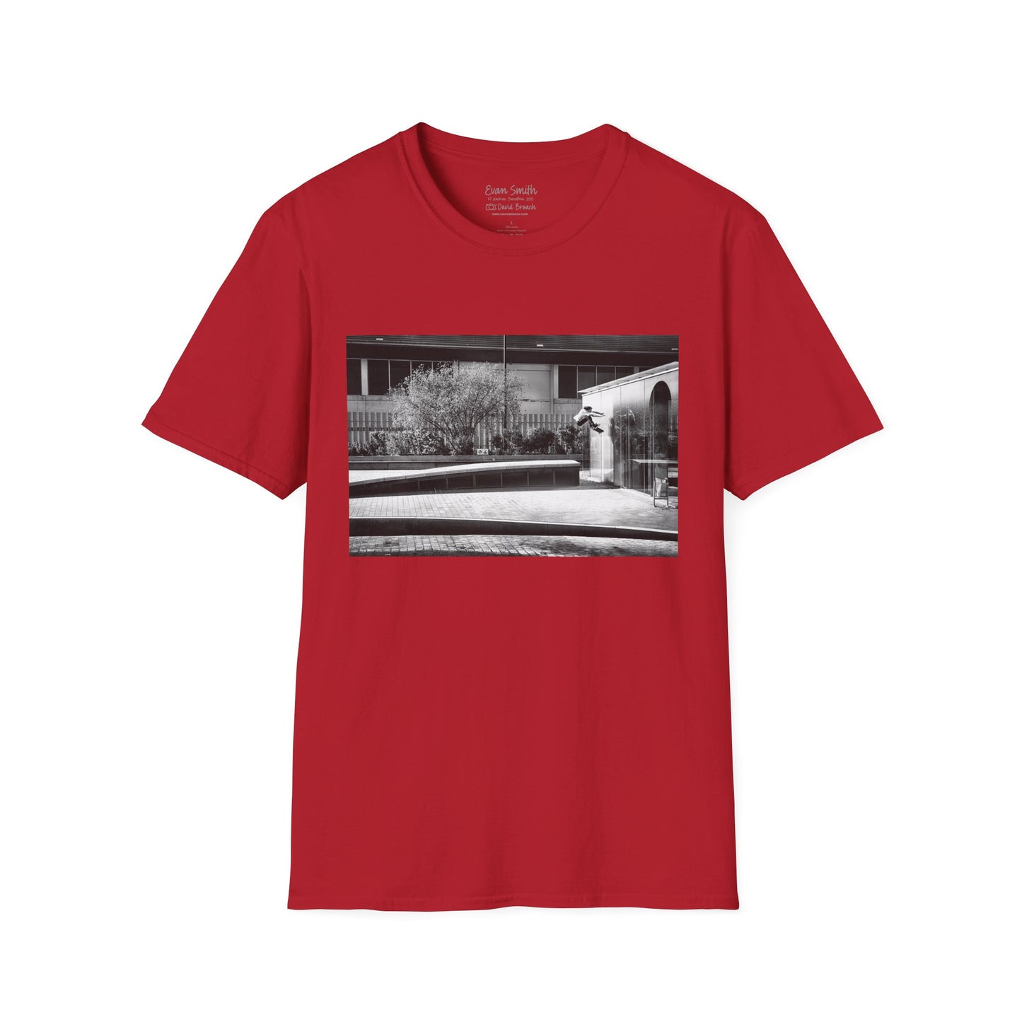 Red Shirt with print of Black and white photo of Evan Smith doing a kick flip wallride in Barcelona Spain. Off bump onto wall.