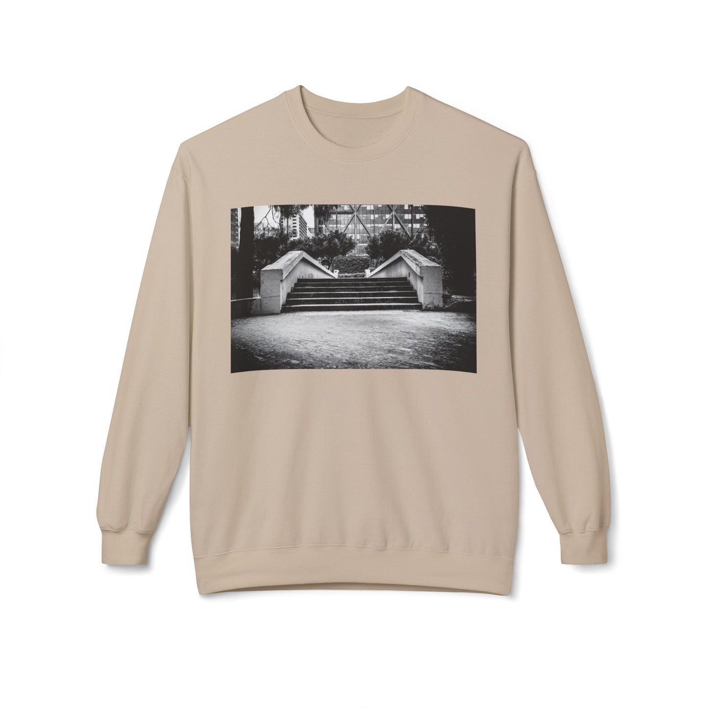 Front view of a cream long-sleeve sweatshirt.  The soft fabric drapes naturally, showcasing the relaxed fit. Ideal for layering or wearing solo, this piece adds a pop of color with a skate-inspired edge."