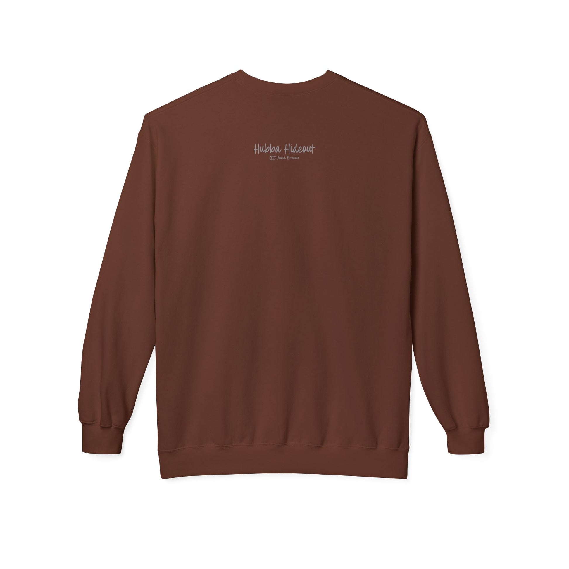 Back of a brown crew neck long-sleeve sweatshirt featuring 'Hubba Hideout' printed in small text near the upper back. A subtle yet stylish detail that complements the bold front design, making it a must-have for skateboarding enthusiasts and streetwear fans.