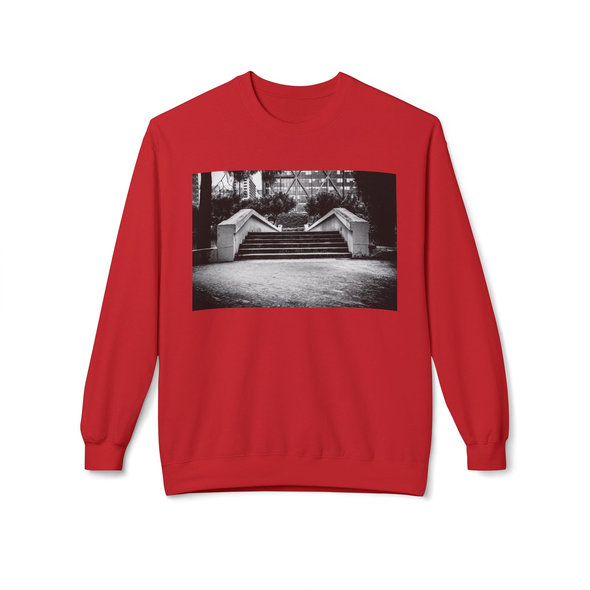 Front view of a red long-sleeve sweatshirt.  The soft fabric drapes naturally, showcasing the relaxed fit. Ideal for layering or wearing solo, this piece adds a pop of color with a skate-inspired edge."
