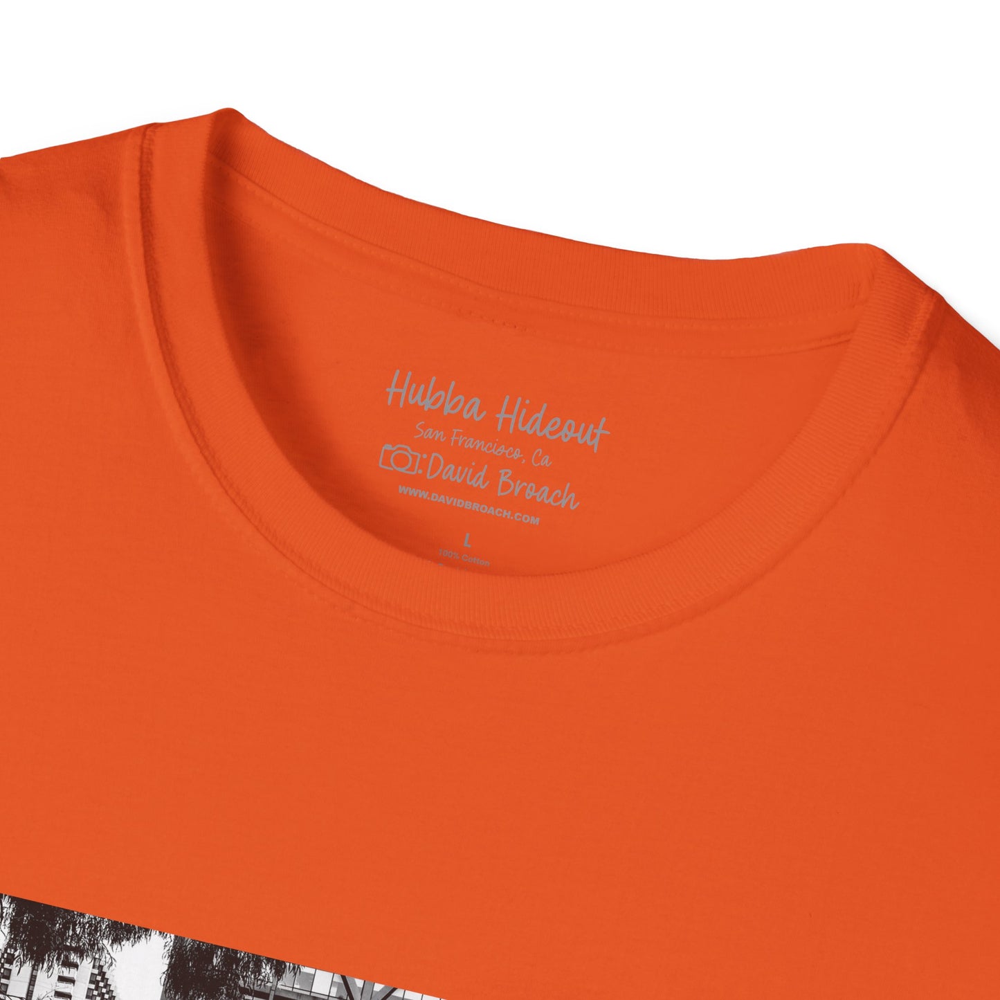Close-up of a orange crew neck short-sleeve T-shirt featuring a printed photo of the iconic Hubba Hideout skate spot, captured by David Broach. The detailed print highlights the texture and depth of the image, making it a bold statement piece for skateboarding enthusiasts.