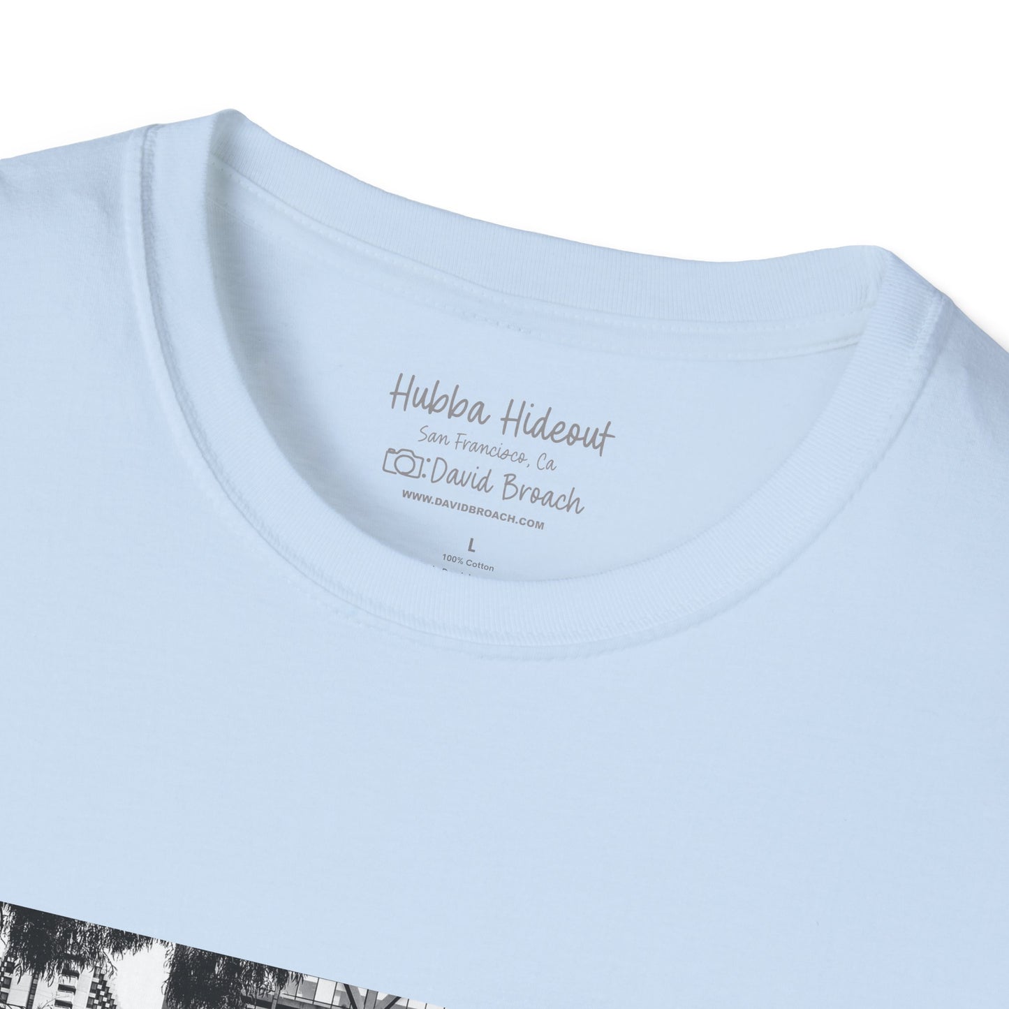 folded blue shirt with black and white photo on it.