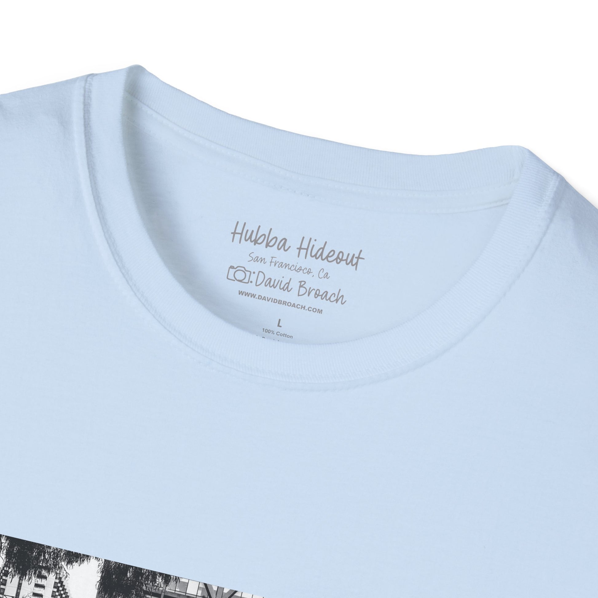 folded blue shirt with black and white photo on it.