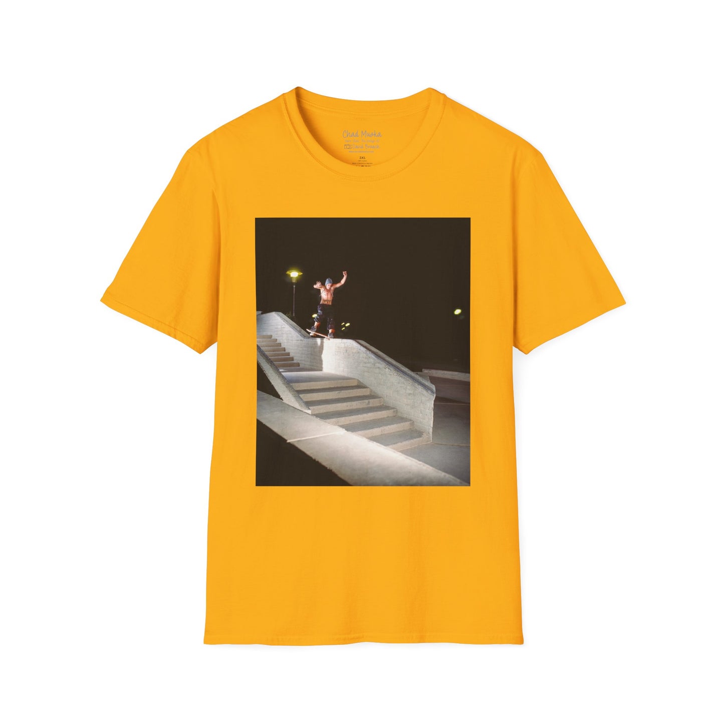 A yellow crew neck short-sleeve T-shirt featuring a printed photo of A high-quality print featuring an iconic shot of Chad Muska in 1999 executing a smooth nose slide down the triple-kink Hubba rail at The Wedge in Phoenix, Arizona. Captured by photographer David Broach, this image showcases Muska’s signature style and fearless approach, making it a must-have for skateboarding enthusiasts and collectors."