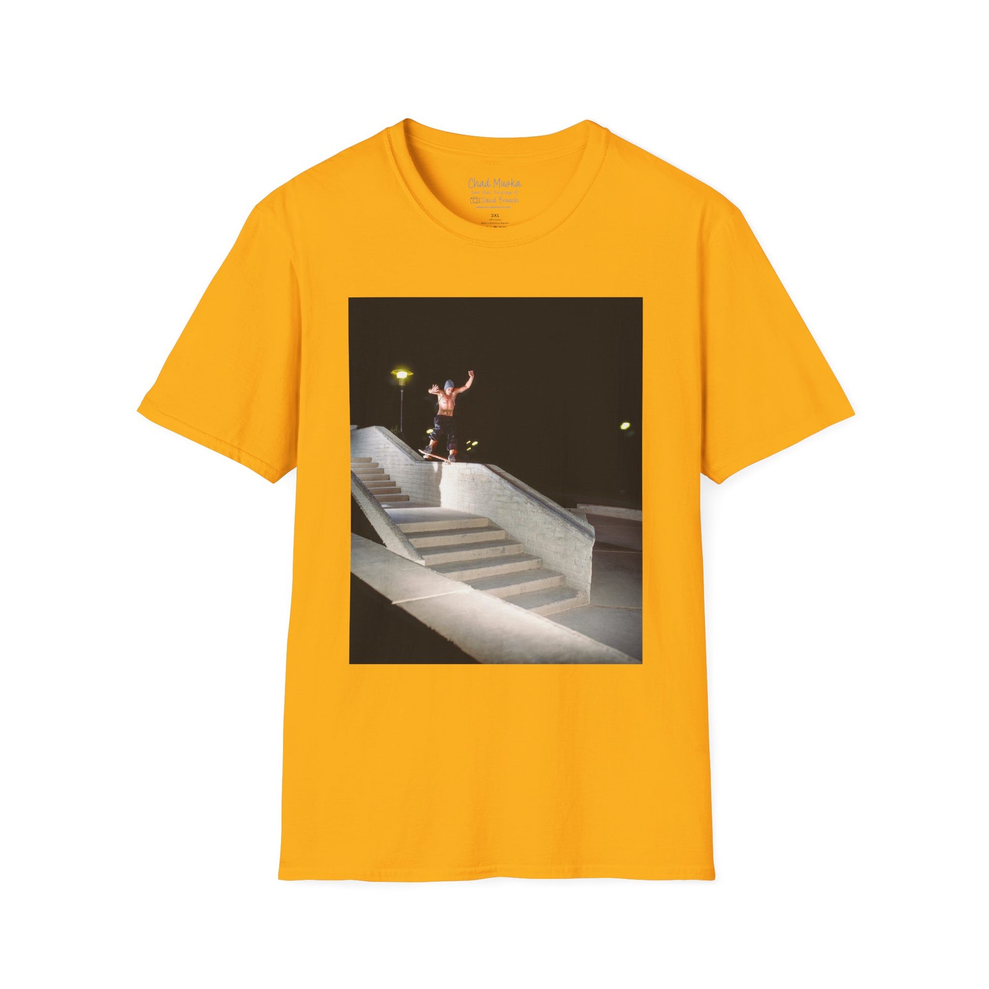 A yellow crew neck short-sleeve T-shirt featuring a printed photo of A high-quality print featuring an iconic shot of Chad Muska in 1999 executing a smooth nose slide down the triple-kink Hubba rail at The Wedge in Phoenix, Arizona. Captured by photographer David Broach, this image showcases Muska’s signature style and fearless approach, making it a must-have for skateboarding enthusiasts and collectors."