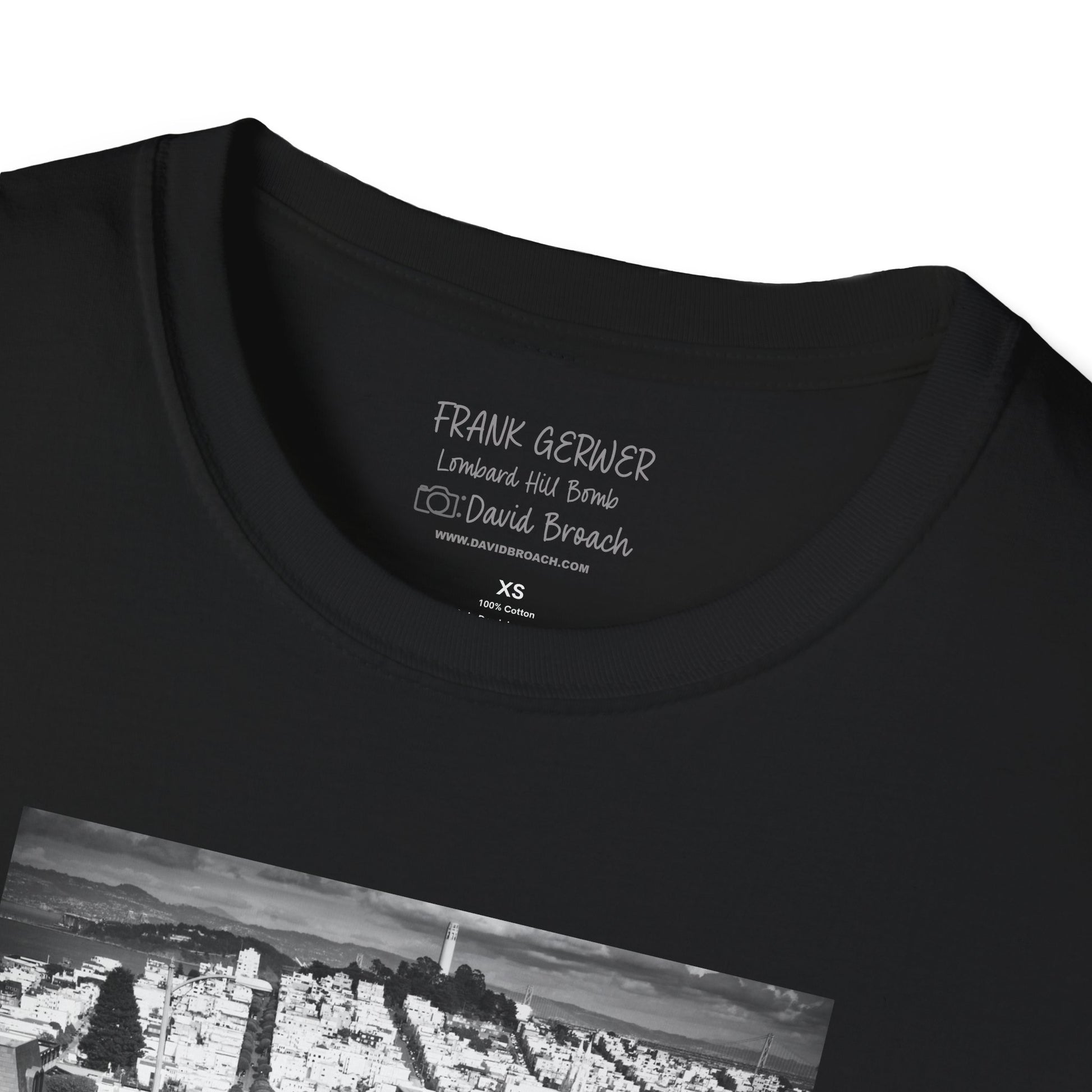 Close-up of the crew neck collar of a black short-sleeve T-shirt featuring 'Frank Gerwer' and 'Photo by David Broach' printed on the inside. A subtle yet distinctive detail that adds authenticity to the design, making it a must-have for skateboarding enthusiasts and collectors.