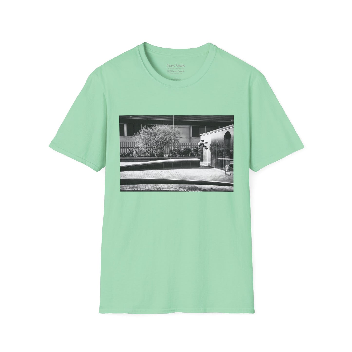 Mint green Shirt with print of Black and white photo of Evan Smith doing a kick flip wallride in Barcelona Spain. Off bump onto wall.