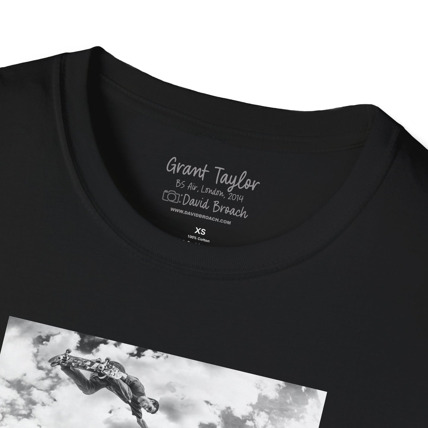 "Close-up of the crew neck collar of a black short-sleeve T-shirt featuring 'Grant Taylor' and 'Photo by David Broach' printed on the inside. This subtle yet distinctive detail adds authenticity and exclusivity to the design, making it a must-have for skateboarding enthusiasts, streetwear collectors, and fans of iconic skate photography.