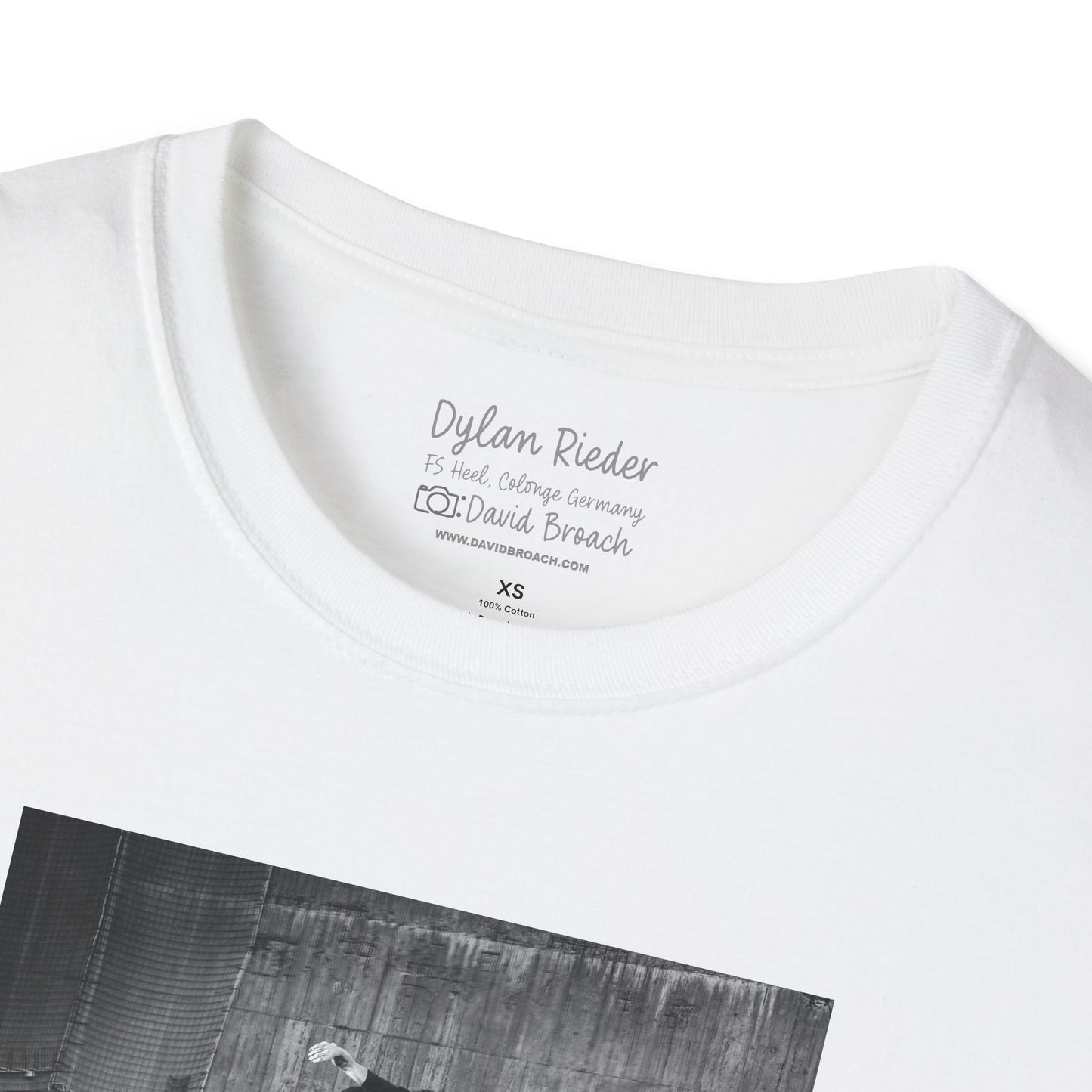 Close-up of a white crew neck collar of a short-sleeve T-shirt featuring 'Dylan Rieder' and 'Photo by David Broach' printed on the inside. A subtle yet distinctive detail that adds authenticity to the design, making it a must-have for skateboarding enthusiasts and collectors.
