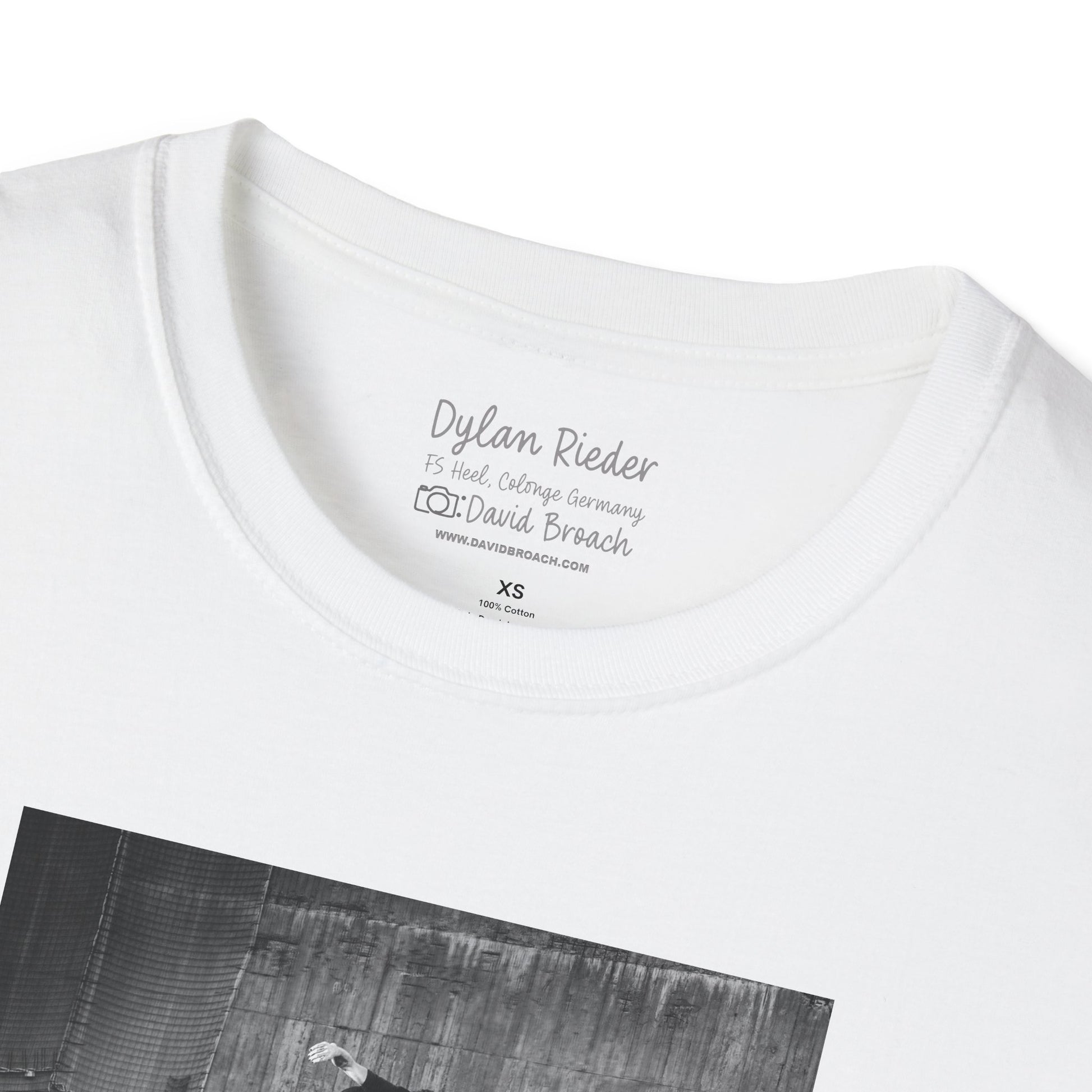 Close-up of a white crew neck collar of a short-sleeve T-shirt featuring 'Dylan Rieder' and 'Photo by David Broach' printed on the inside. A subtle yet distinctive detail that adds authenticity to the design, making it a must-have for skateboarding enthusiasts and collectors.