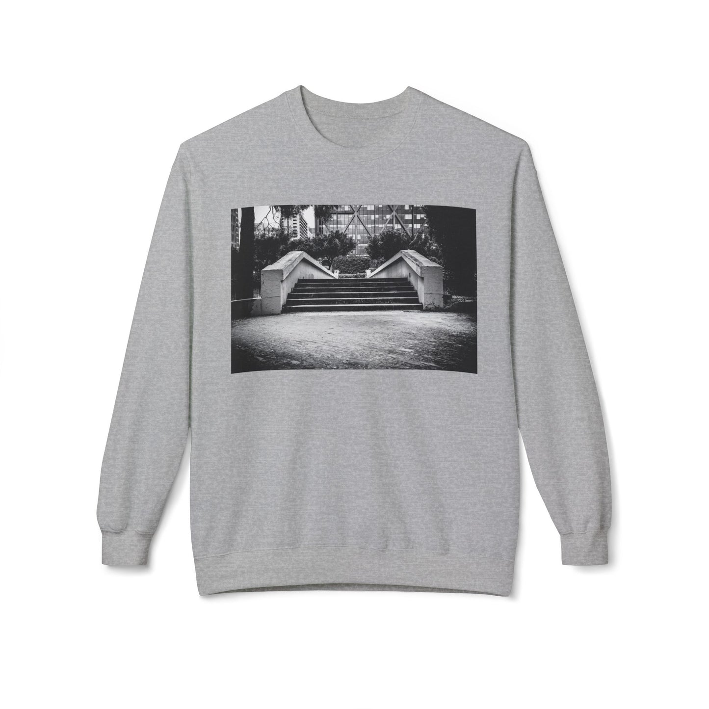 Front view of a greylong-sleeve sweatshirt.  The soft fabric drapes naturally, showcasing the relaxed fit. Ideal for layering or wearing solo, this piece adds a pop of color with a skate-inspired edge."