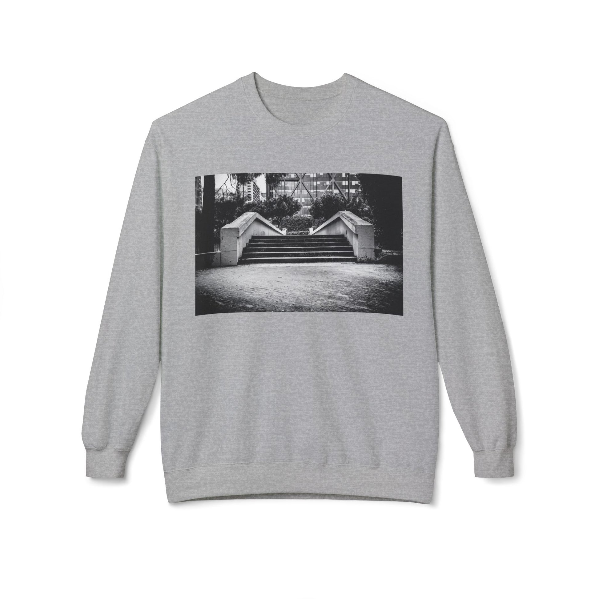 Front view of a greylong-sleeve sweatshirt.  The soft fabric drapes naturally, showcasing the relaxed fit. Ideal for layering or wearing solo, this piece adds a pop of color with a skate-inspired edge."
