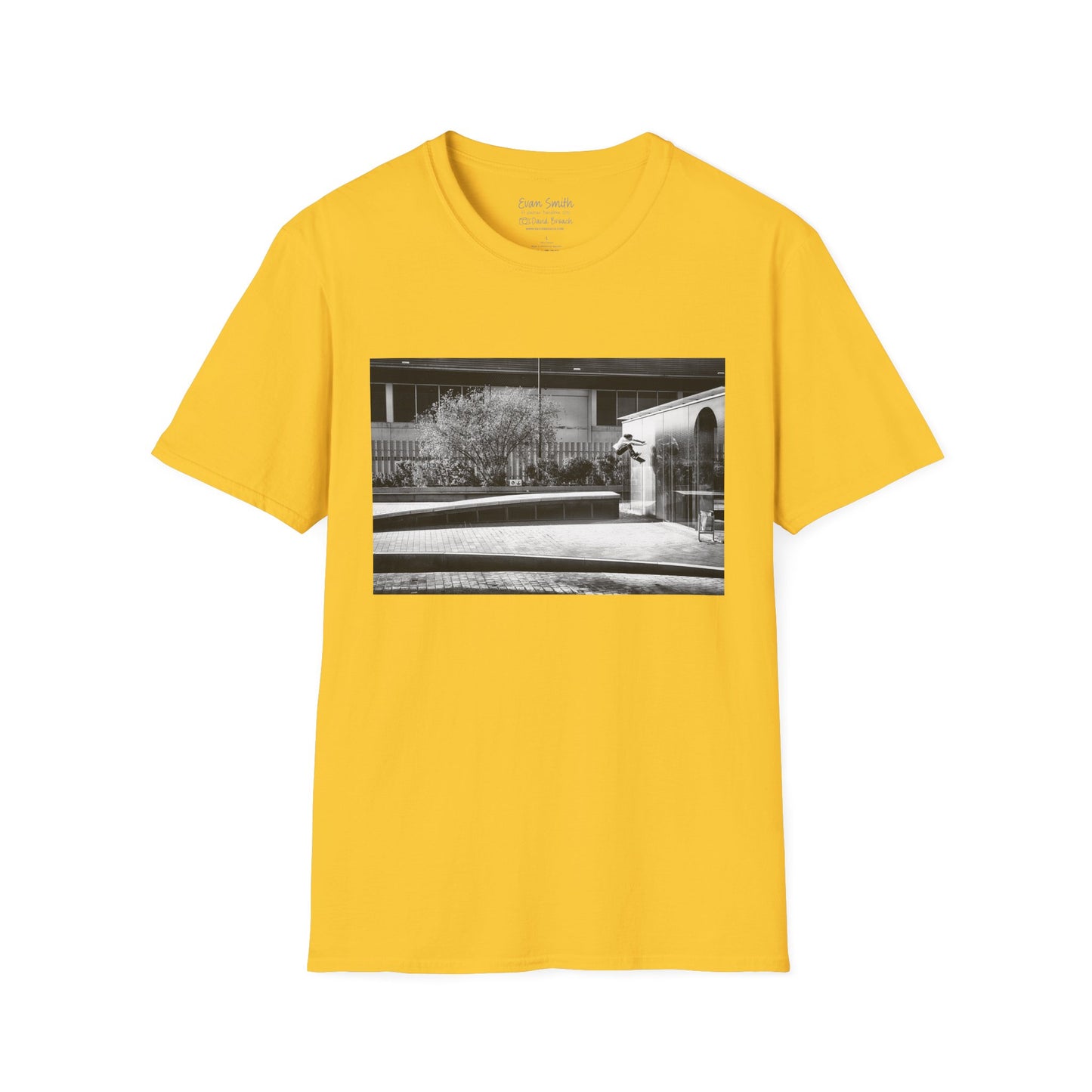 Yellow Shirt with print of Black and white photo of Evan Smith doing a kick flip wallride in Barcelona Spain. Off bump onto wall.