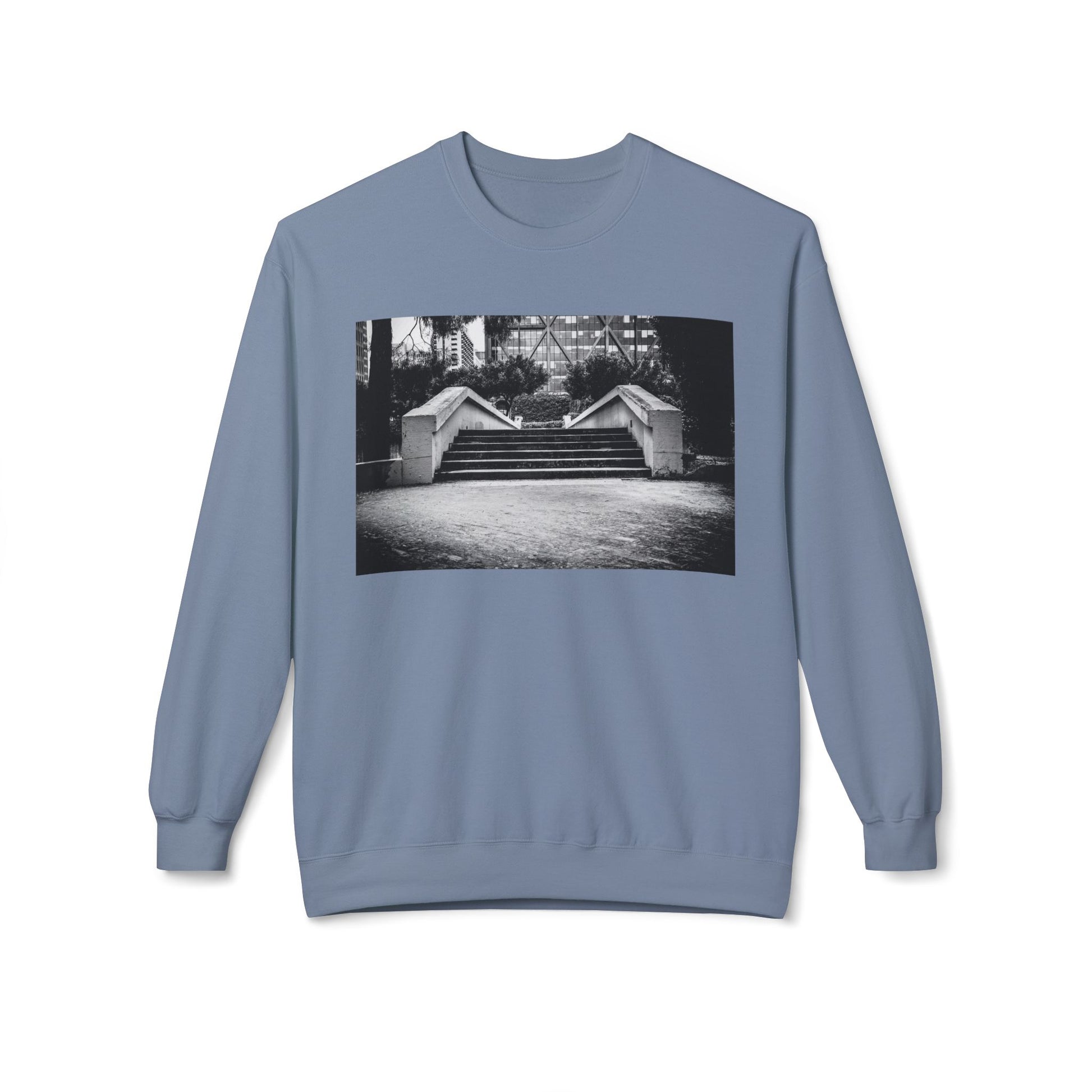 Front view of a light blue long-sleeve sweatshirt.  The soft fabric drapes naturally, showcasing the relaxed fit. Ideal for layering or wearing solo, this piece adds a pop of color with a skate-inspired edge."