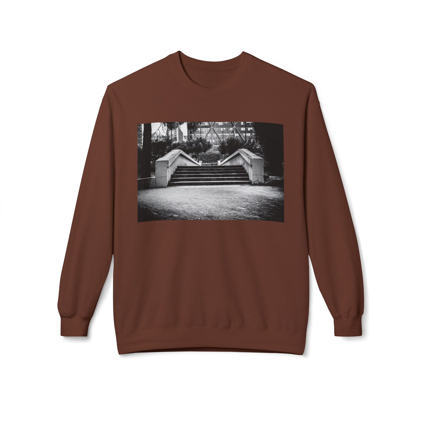 Front view of a brown long-sleeve sweatshirt.  The soft fabric drapes naturally, showcasing the relaxed fit. Ideal for layering or wearing solo, this piece adds a pop of color with a skate-inspired edge."