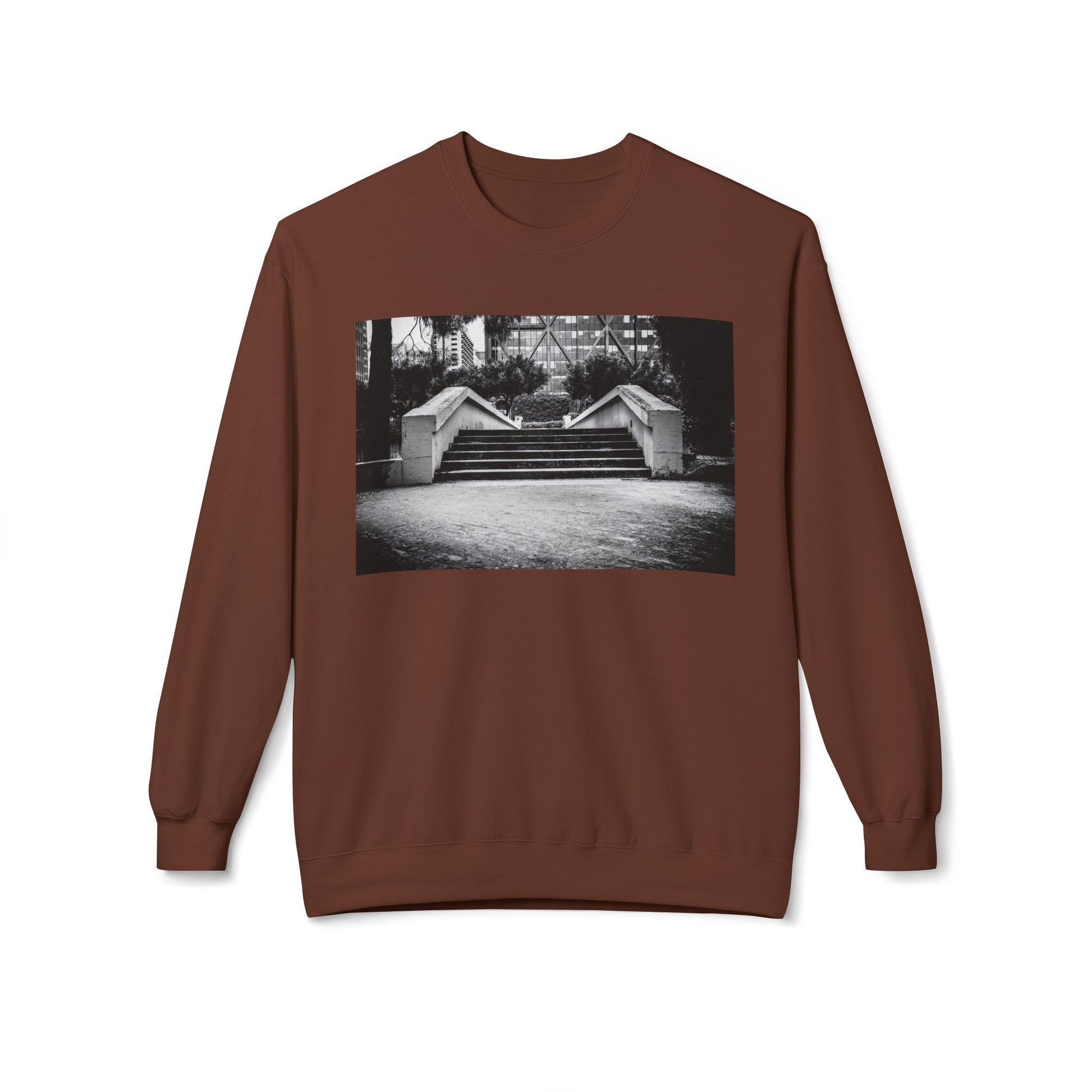 Front view of a brown long-sleeve sweatshirt.  The soft fabric drapes naturally, showcasing the relaxed fit. Ideal for layering or wearing solo, this piece adds a pop of color with a skate-inspired edge."