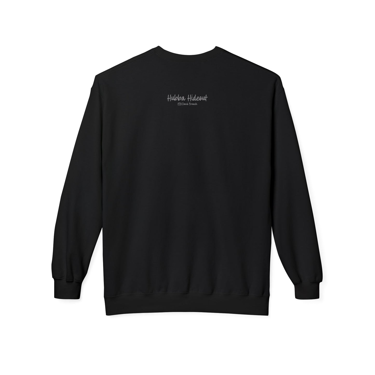 Back of a black crew neck long-sleeve sweatshirt featuring 'Hubba Hideout' printed in small text near the upper back. A subtle yet stylish detail that complements the bold front design, making it a must-have for skateboarding enthusiasts and streetwear fans.