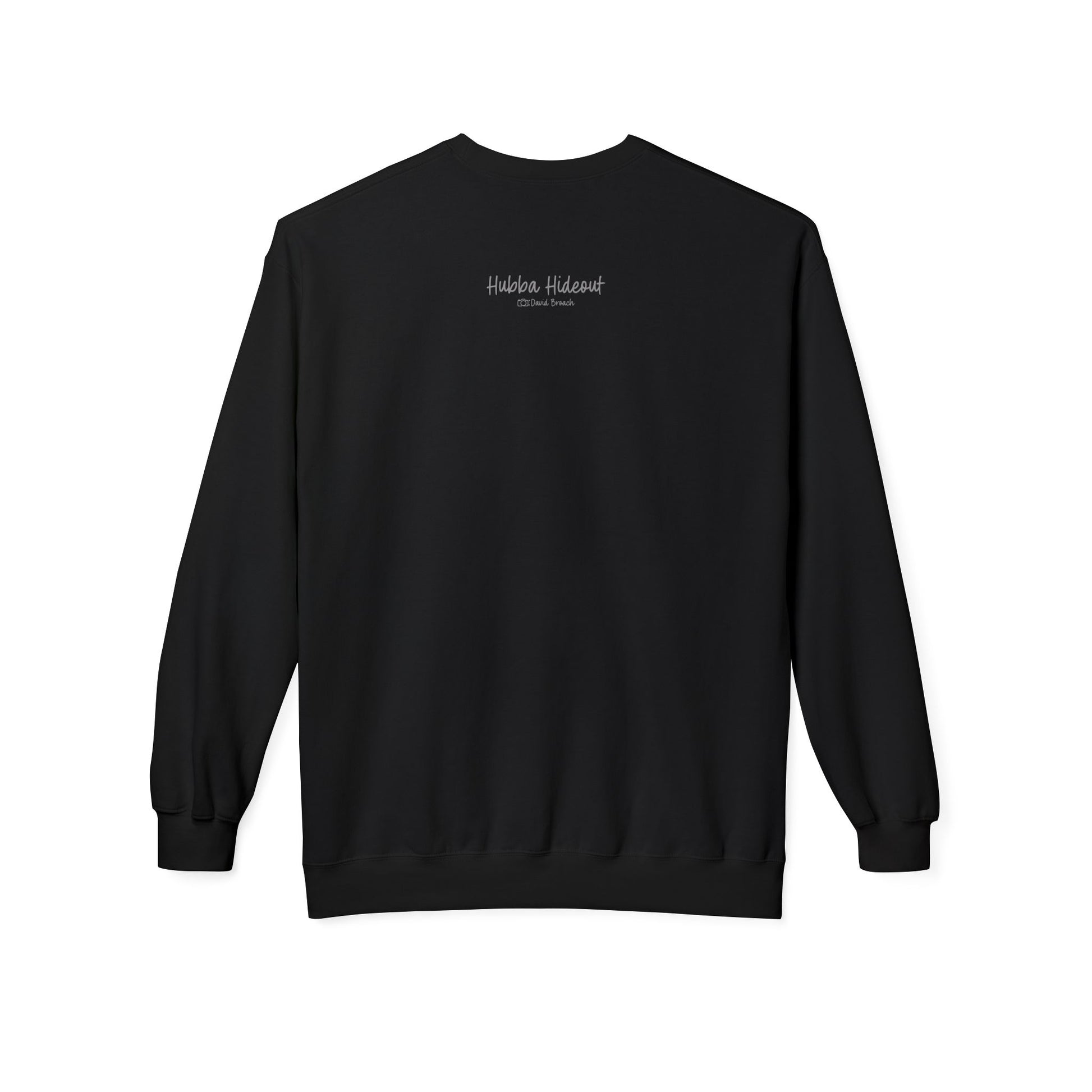 Back of a black crew neck long-sleeve sweatshirt featuring 'Hubba Hideout' printed in small text near the upper back. A subtle yet stylish detail that complements the bold front design, making it a must-have for skateboarding enthusiasts and streetwear fans.