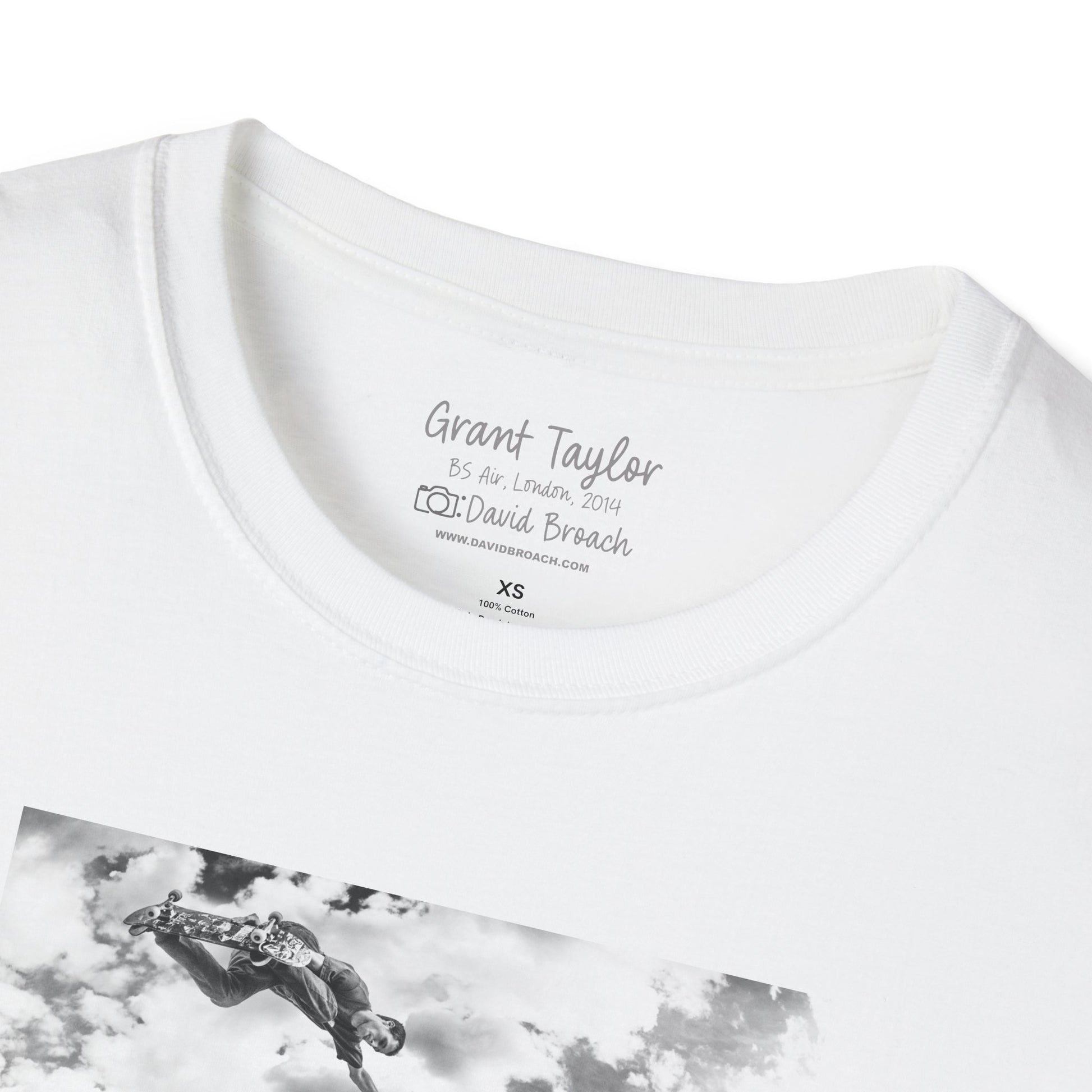 "Close-up of the crew neck collar of a white short-sleeve T-shirt featuring 'Grant Taylor' and 'Photo by David Broach' printed on the inside. This subtle yet distinctive detail adds authenticity and exclusivity to the design, making it a must-have for skateboarding enthusiasts, streetwear collectors, and fans of iconic skate photography.