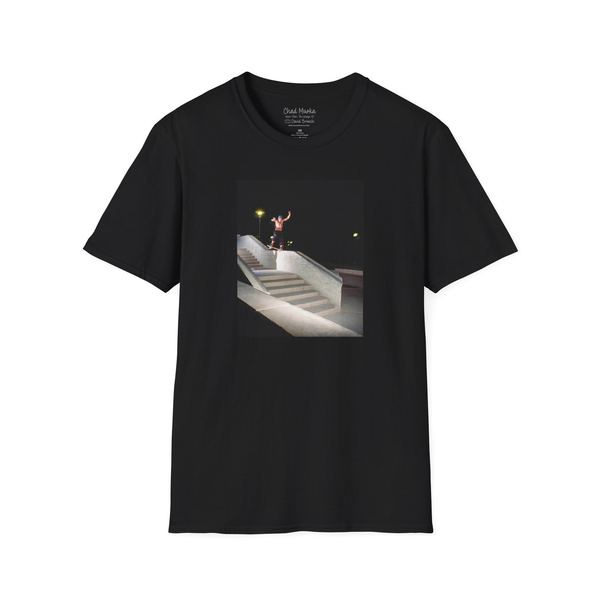 A black crew neck short-sleeve T-shirt featuring a printed photo of A high-quality print featuring an iconic shot of Chad Muska in 1999 executing a smooth nose slide down the triple-kink Hubba rail at The Wedge in Phoenix, Arizona. Captured by photographer David Broach, this image showcases Muska’s signature style and fearless approach, making it a must-have for skateboarding enthusiasts and collectors."