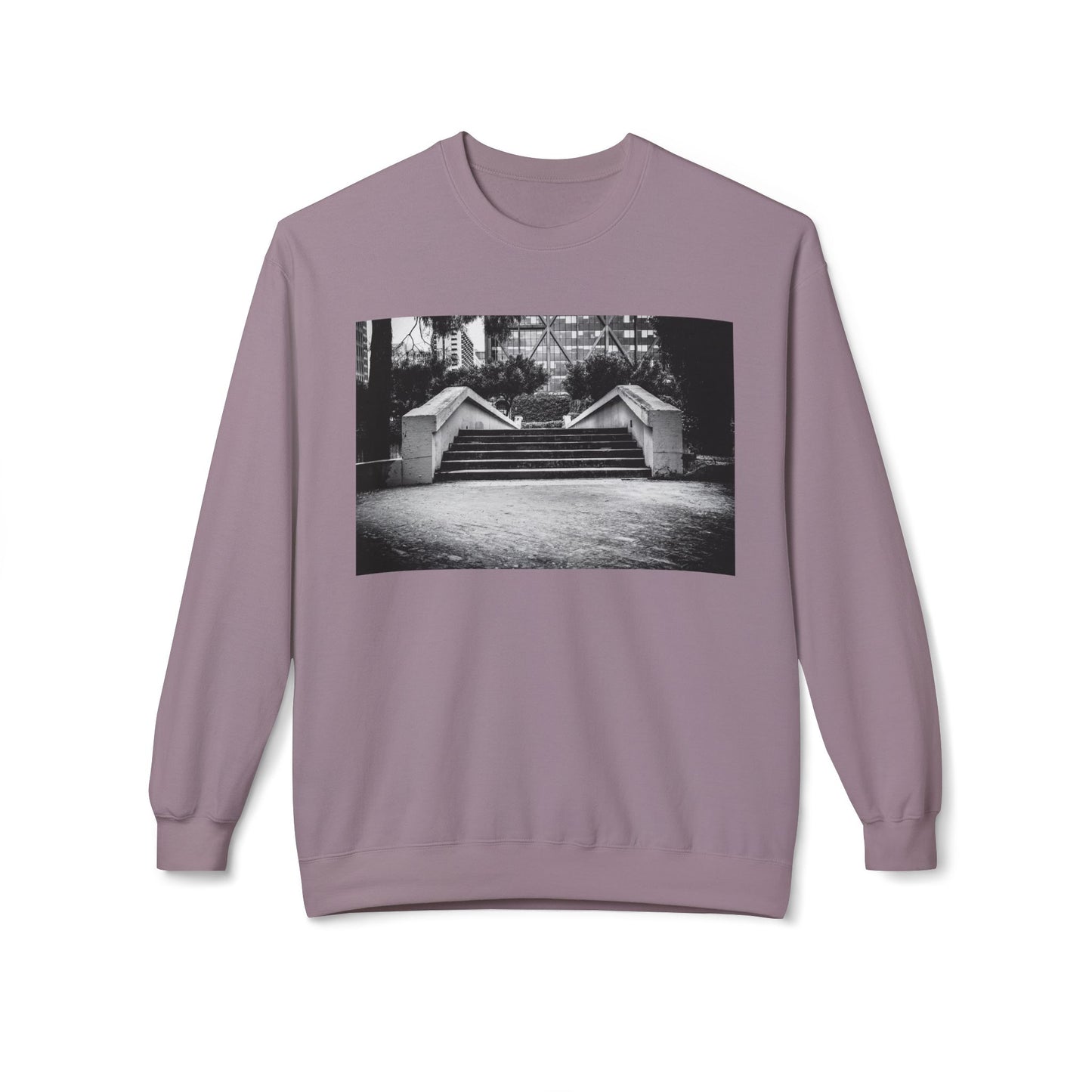 Front view of a purple long-sleeve sweatshirt.  The soft fabric drapes naturally, showcasing the relaxed fit. Ideal for layering or wearing solo, this piece adds a pop of color with a skate-inspired edge."