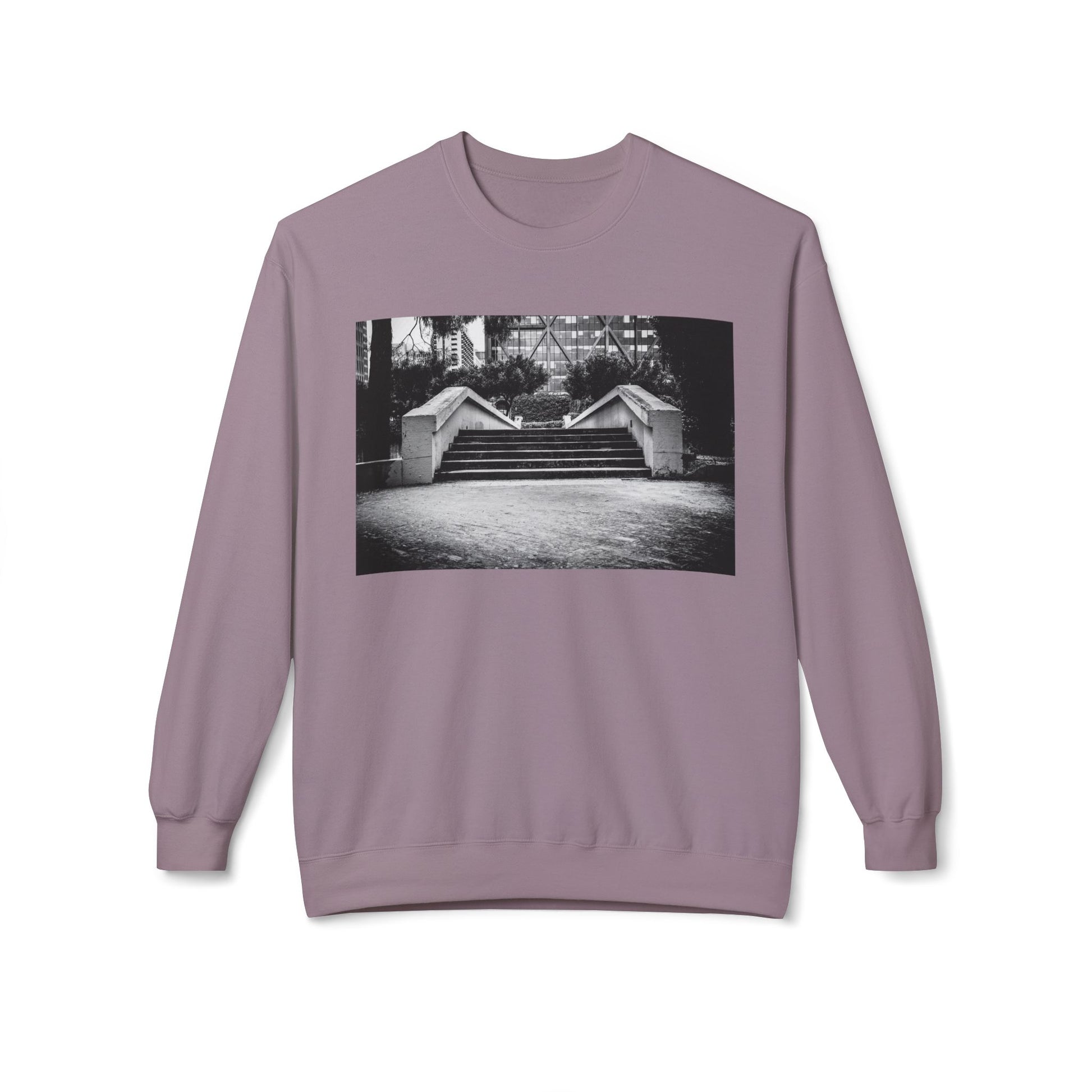 Front view of a purple long-sleeve sweatshirt.  The soft fabric drapes naturally, showcasing the relaxed fit. Ideal for layering or wearing solo, this piece adds a pop of color with a skate-inspired edge."
