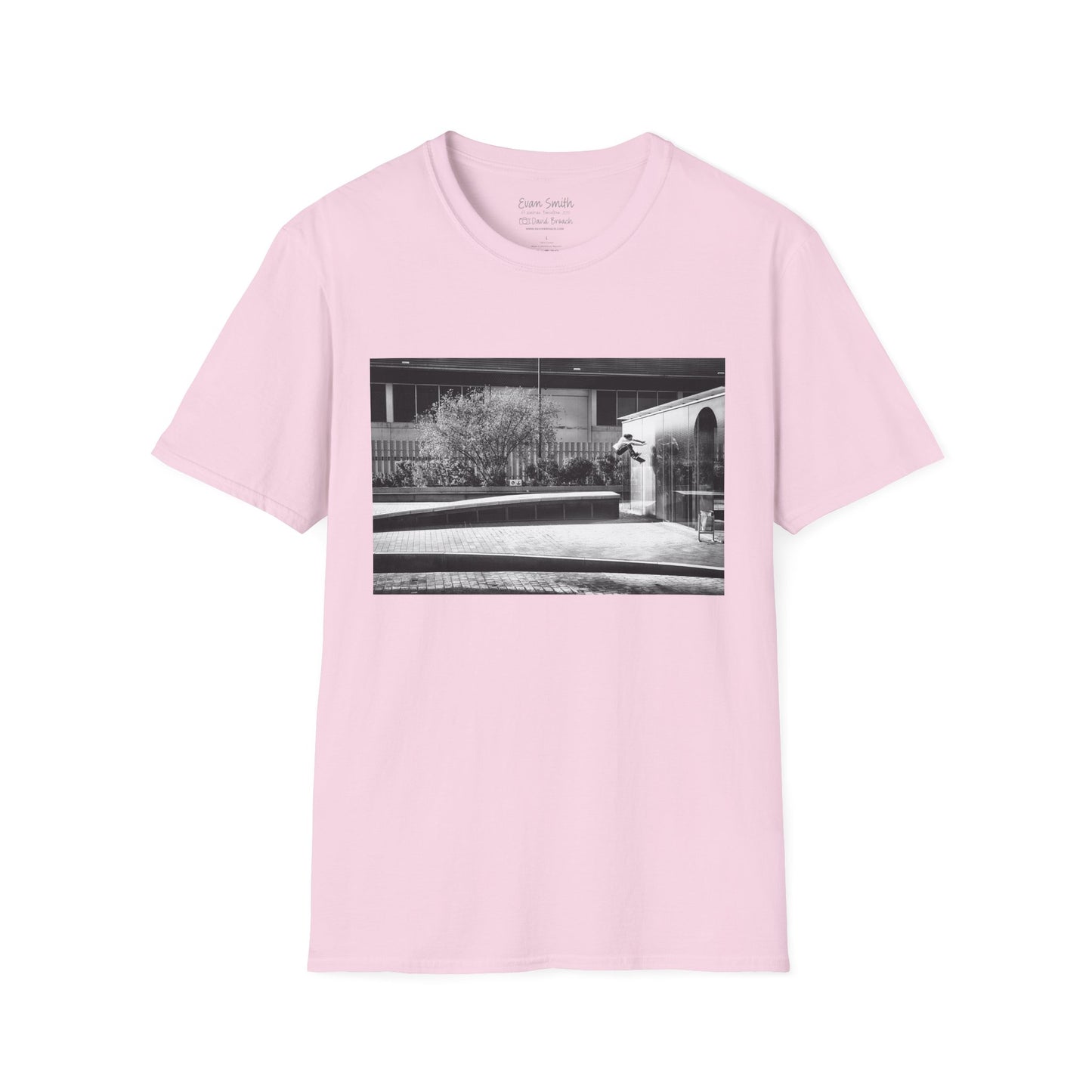 Pink Shirt with print of Black and white photo of Evan Smith doing a kick flip wallride in Barcelona Spain. Off bump onto wall.