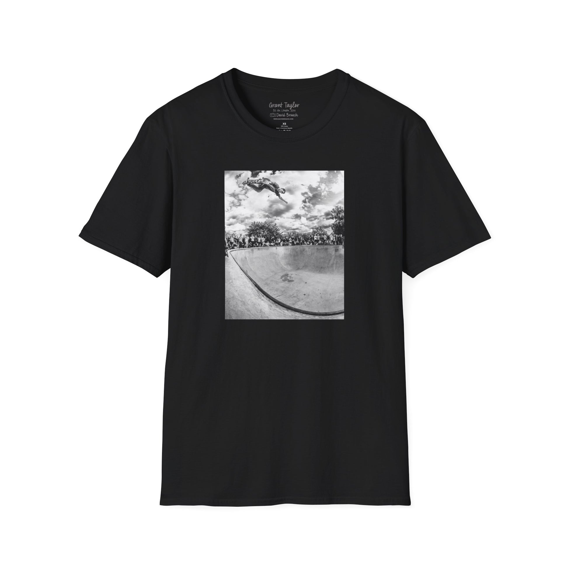 Photo of a black Short-sleeve crew neck T-shirt featuring a high-quality black-and-white photo of Grant Taylor blasting a massive backside air out of the deep end of a pool in London, England. Captured by renowned skate photographer David Broach, this striking design showcases Grant’s raw power and effortless style. A must-have for skateboarding enthusiasts, streetwear fans, and collectors of iconic skate photography.