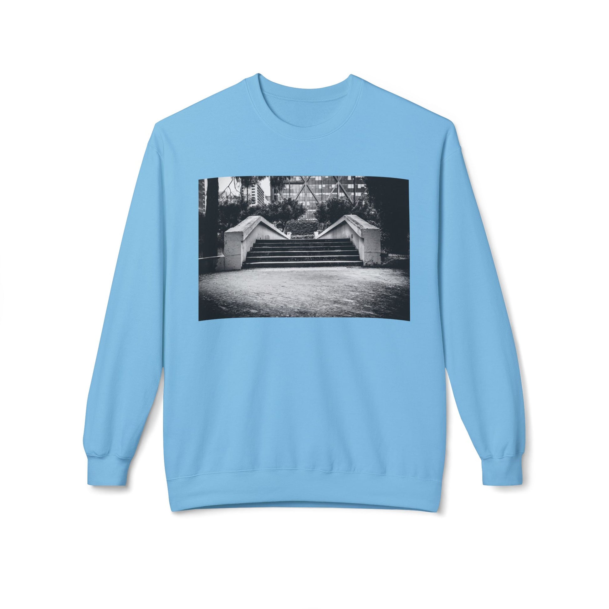 Front view of a blue long-sleeve sweatshirt.  The soft fabric drapes naturally, showcasing the relaxed fit. Ideal for layering or wearing solo, this piece adds a pop of color with a skate-inspired edge."