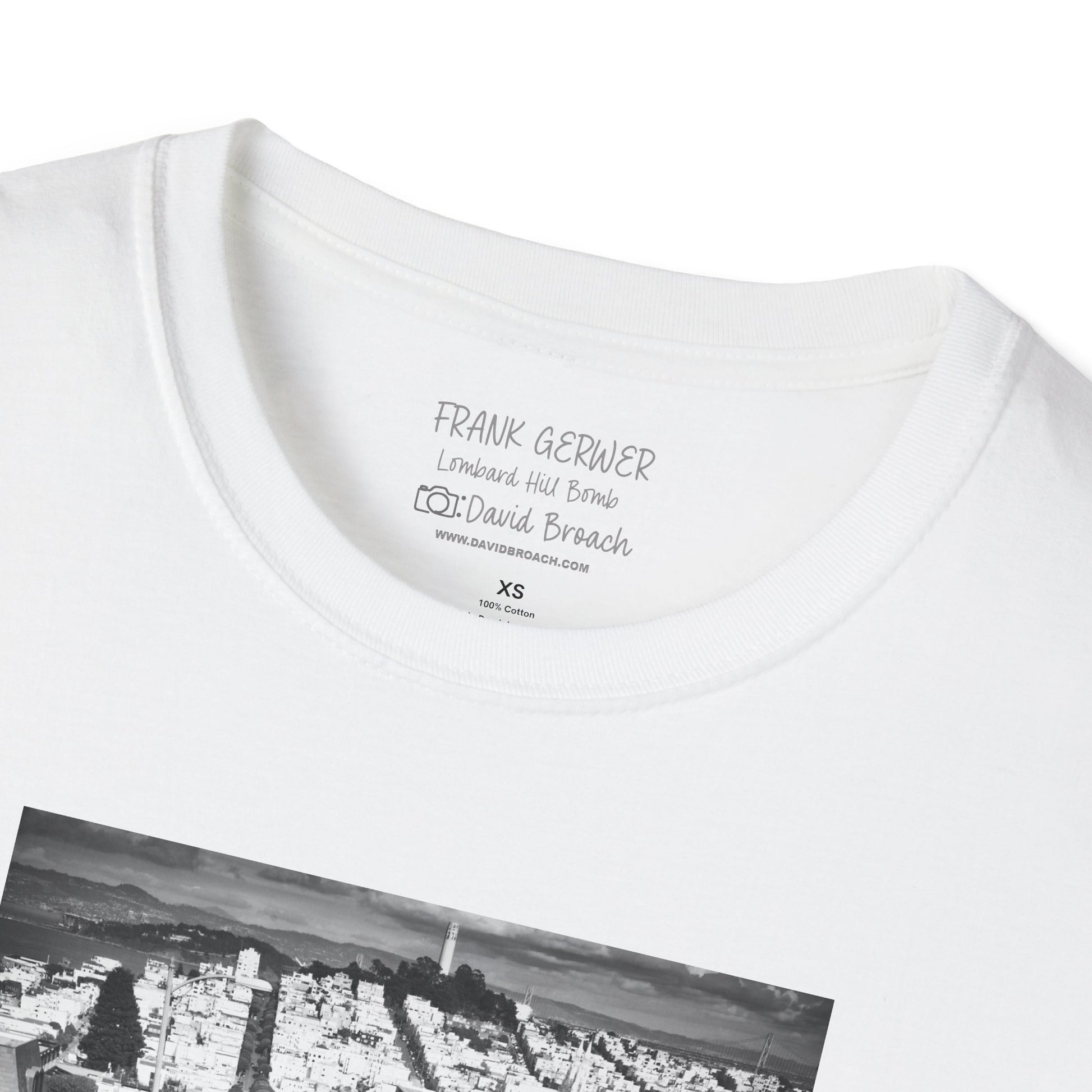 Close-up of the crew neck collar of a white short-sleeve T-shirt featuring 'Frank Gerwer' and 'Photo by David Broach' printed on the inside. A subtle yet distinctive detail that adds authenticity to the design, making it a must-have for skateboarding enthusiasts and collectors.