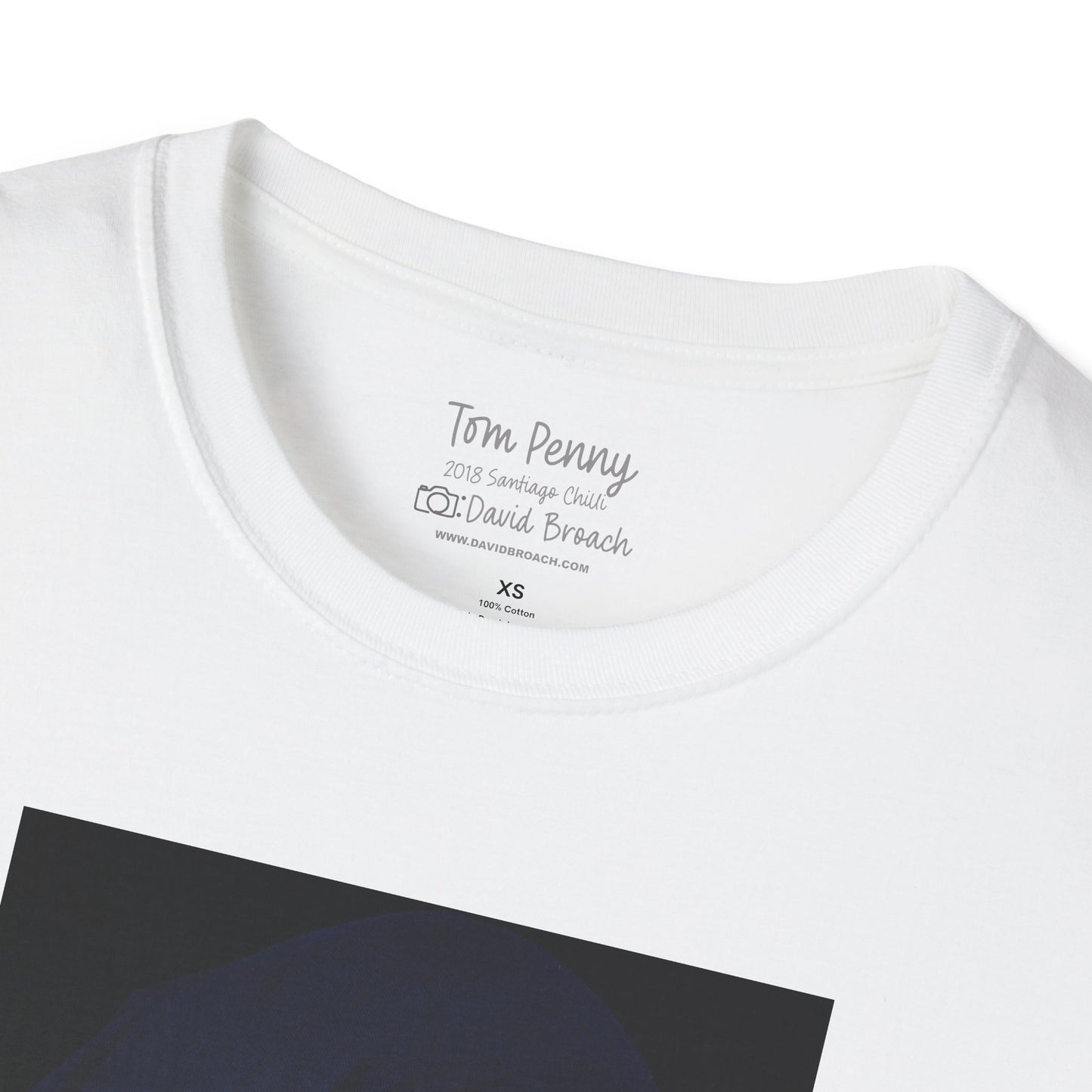 Close-up of white crew neck collar of a short-sleeve T-shirt featuring 'Tom Penny' and 'Photo by David Broach' printed on the inside. A subtle yet distinctive detail that adds authenticity to the design, making it a must-have for skateboarding enthusiasts and collectors.