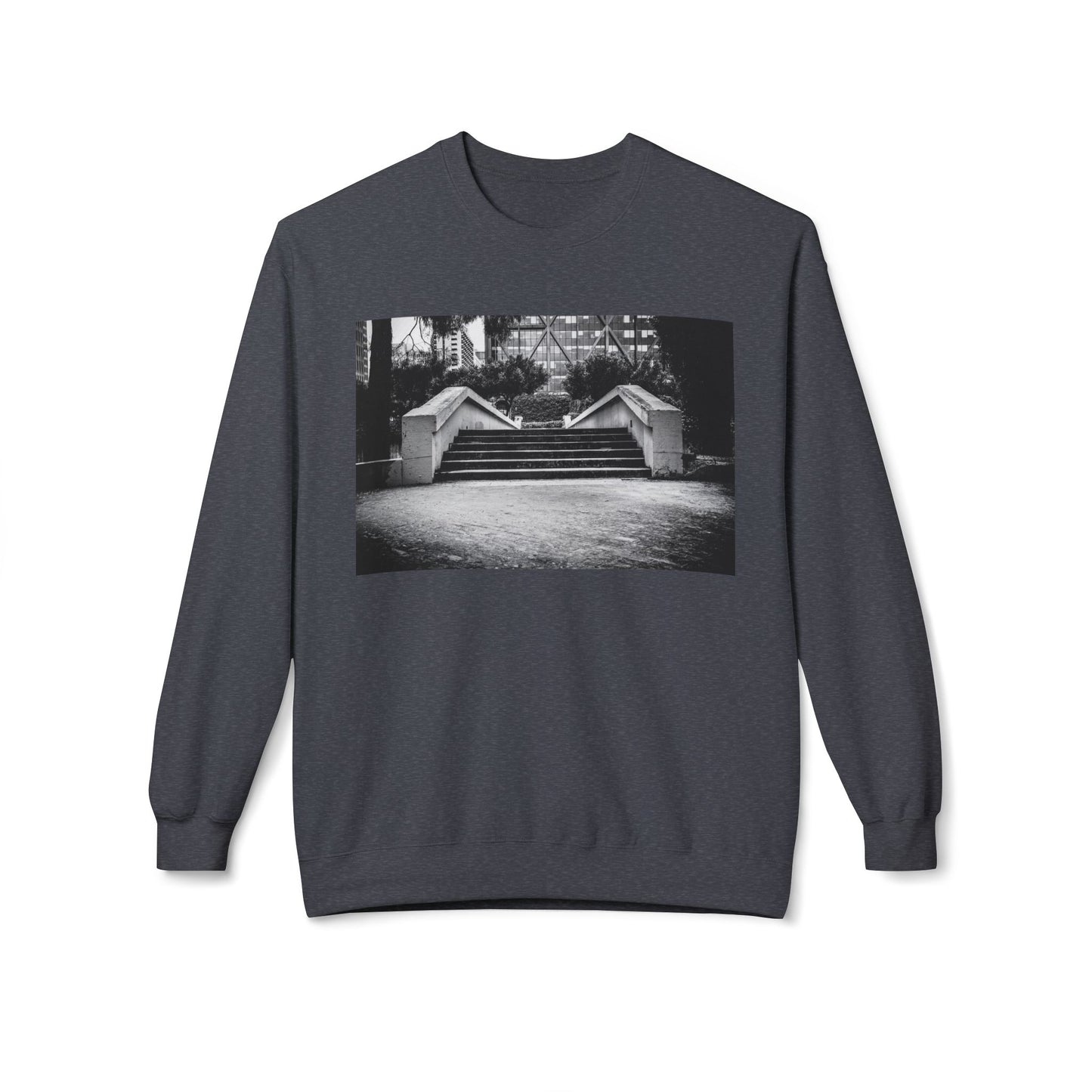 Front view of a dark grey long-sleeve sweatshirt.  The soft fabric drapes naturally, showcasing the relaxed fit. Ideal for layering or wearing solo, this piece adds a pop of color with a skate-inspired edge."