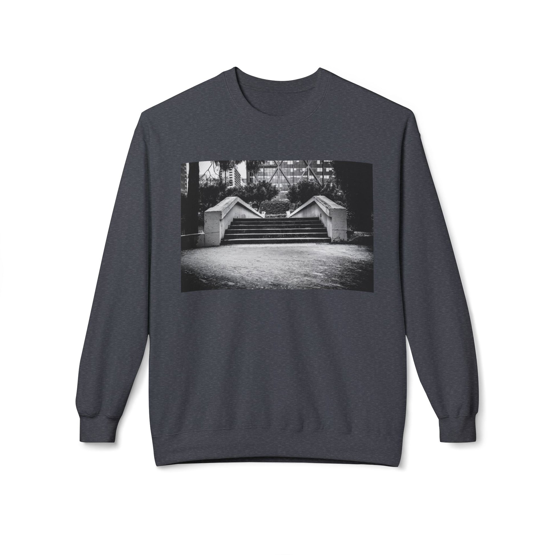 Front view of a dark grey long-sleeve sweatshirt.  The soft fabric drapes naturally, showcasing the relaxed fit. Ideal for layering or wearing solo, this piece adds a pop of color with a skate-inspired edge."