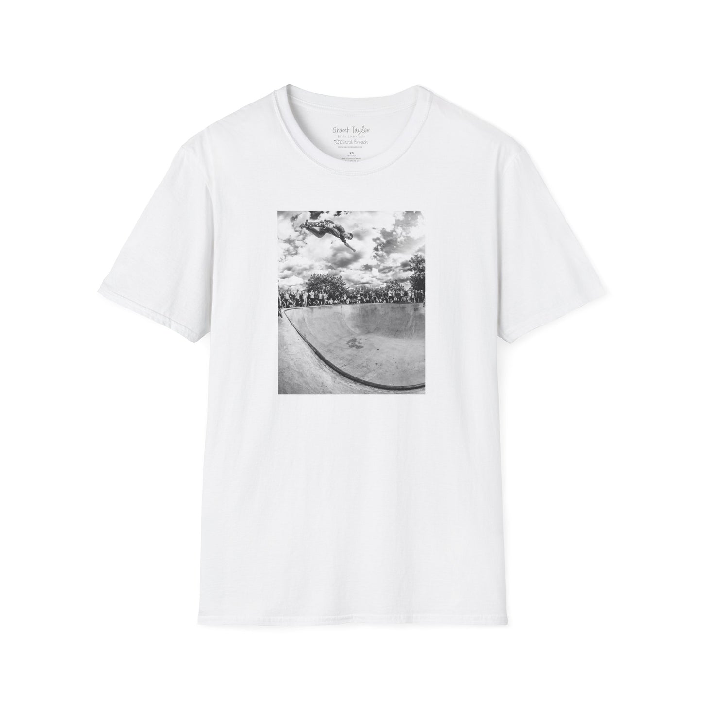 Photo of a white Short-sleeve crew neck T-shirt featuring a high-quality black-and-white photo of Grant Taylor blasting a massive backside air out of the deep end of a pool in London, England. Captured by renowned skate photographer David Broach, this striking design showcases Grant’s raw power and effortless style. A must-have for skateboarding enthusiasts, streetwear fans, and collectors of iconic skate photography.