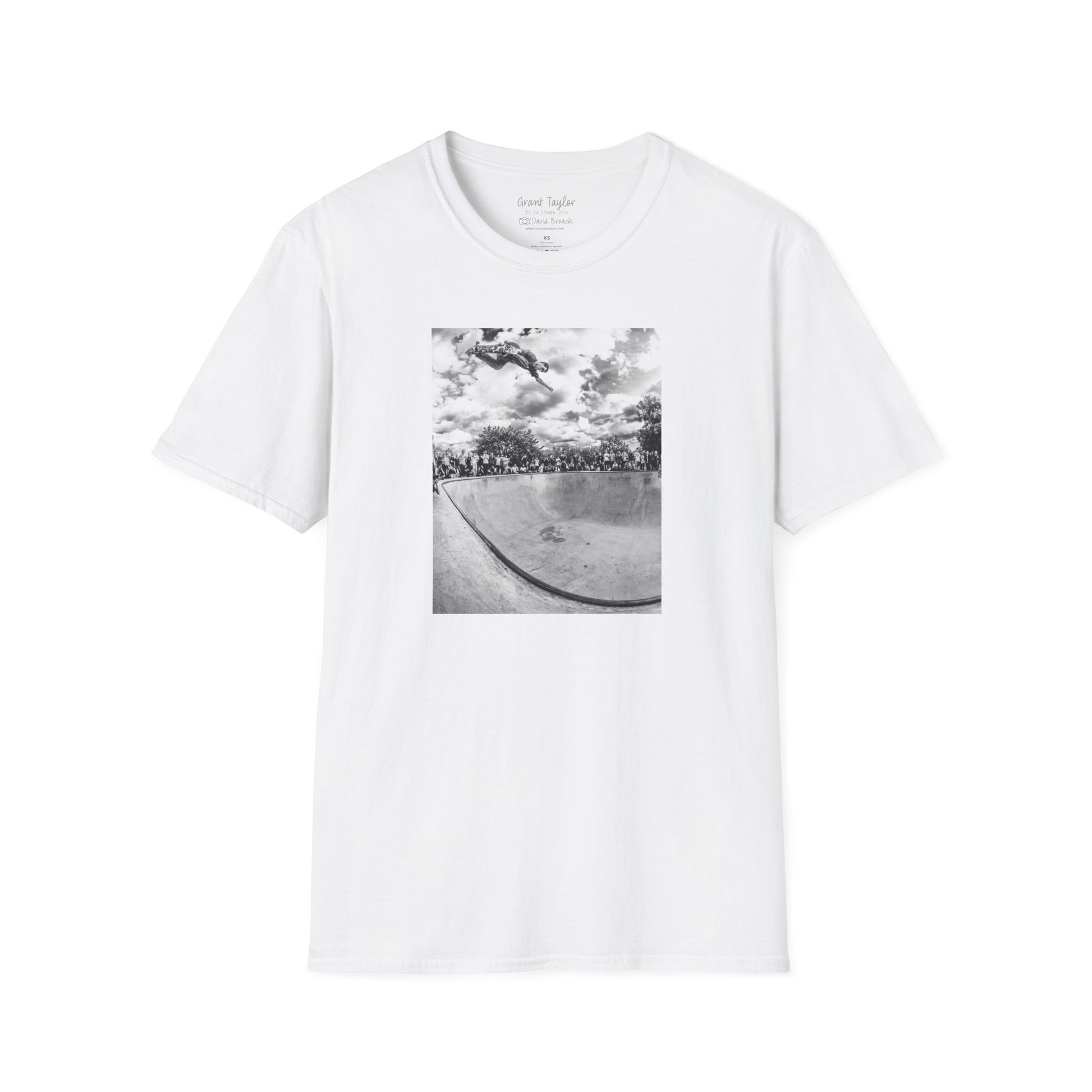 Photo of a white Short-sleeve crew neck T-shirt featuring a high-quality black-and-white photo of Grant Taylor blasting a massive backside air out of the deep end of a pool in London, England. Captured by renowned skate photographer David Broach, this striking design showcases Grant’s raw power and effortless style. A must-have for skateboarding enthusiasts, streetwear fans, and collectors of iconic skate photography.