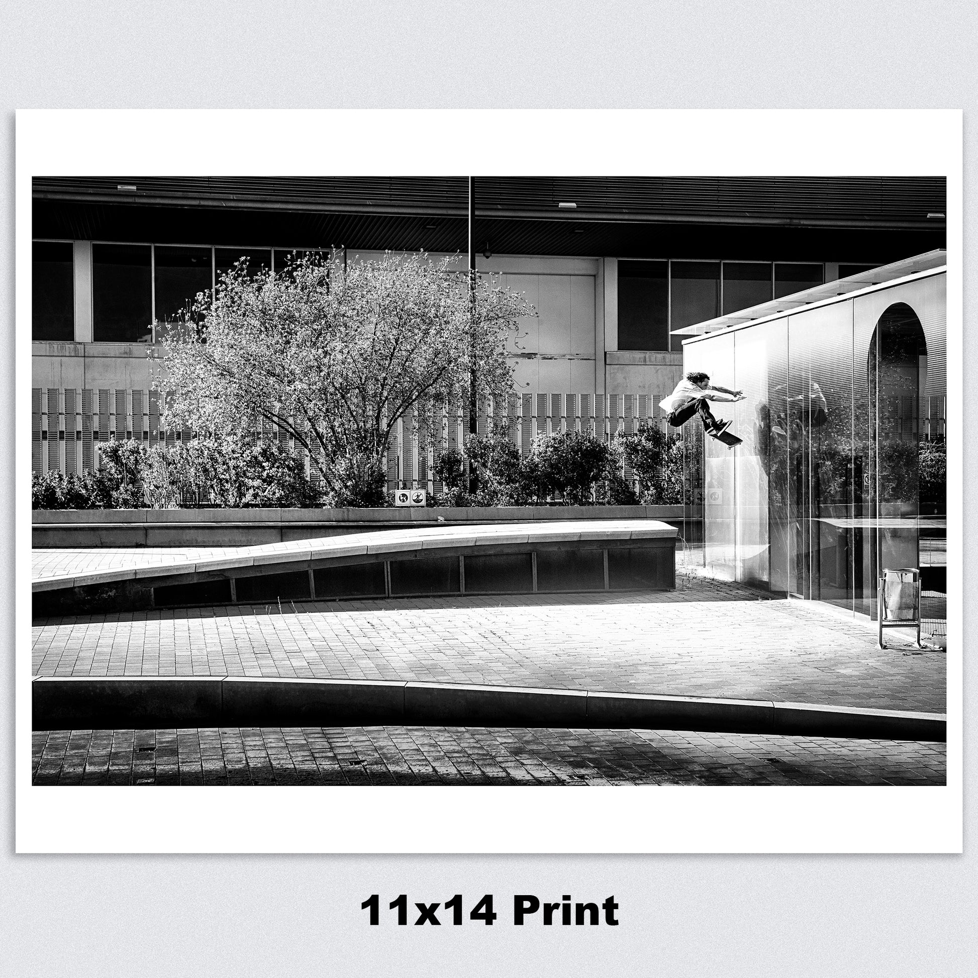 11 x 14 A high-quality archival matte paper print featuring a black-and-white photo of Evan Smith executing a stylish kickflip wallride in Barcelona, Spain. Launching off a bump onto the wall, Evan’s creativity and effortless flow are captured in striking contrast by renowned skate photographer David Broach. Printed on premium archival matte paper for exceptional detail and longevity, making it a must-have for skateboarding enthusiasts, collectors, and fans of classic skate photography.