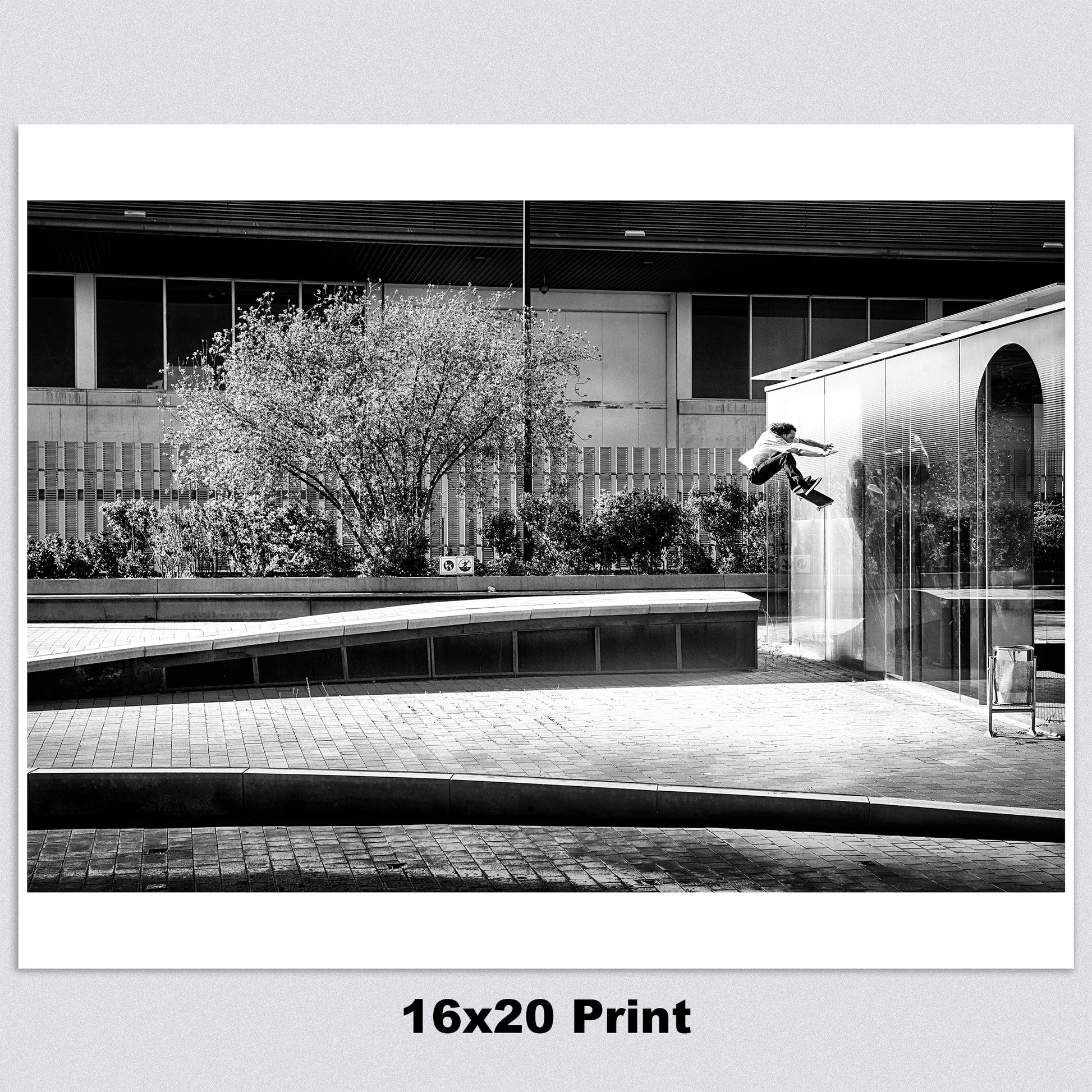 16 x 20  high-quality archival matte paper print featuring a black-and-white photo of Evan Smith executing a stylish kickflip wallride in Barcelona, Spain. Launching off a bump onto the wall, Evan’s creativity and effortless flow are captured in striking contrast by renowned skate photographer David Broach. Printed on premium archival matte paper for exceptional detail and longevity, making it a must-have for skateboarding enthusiasts, collectors, and fans of classic skate photography.