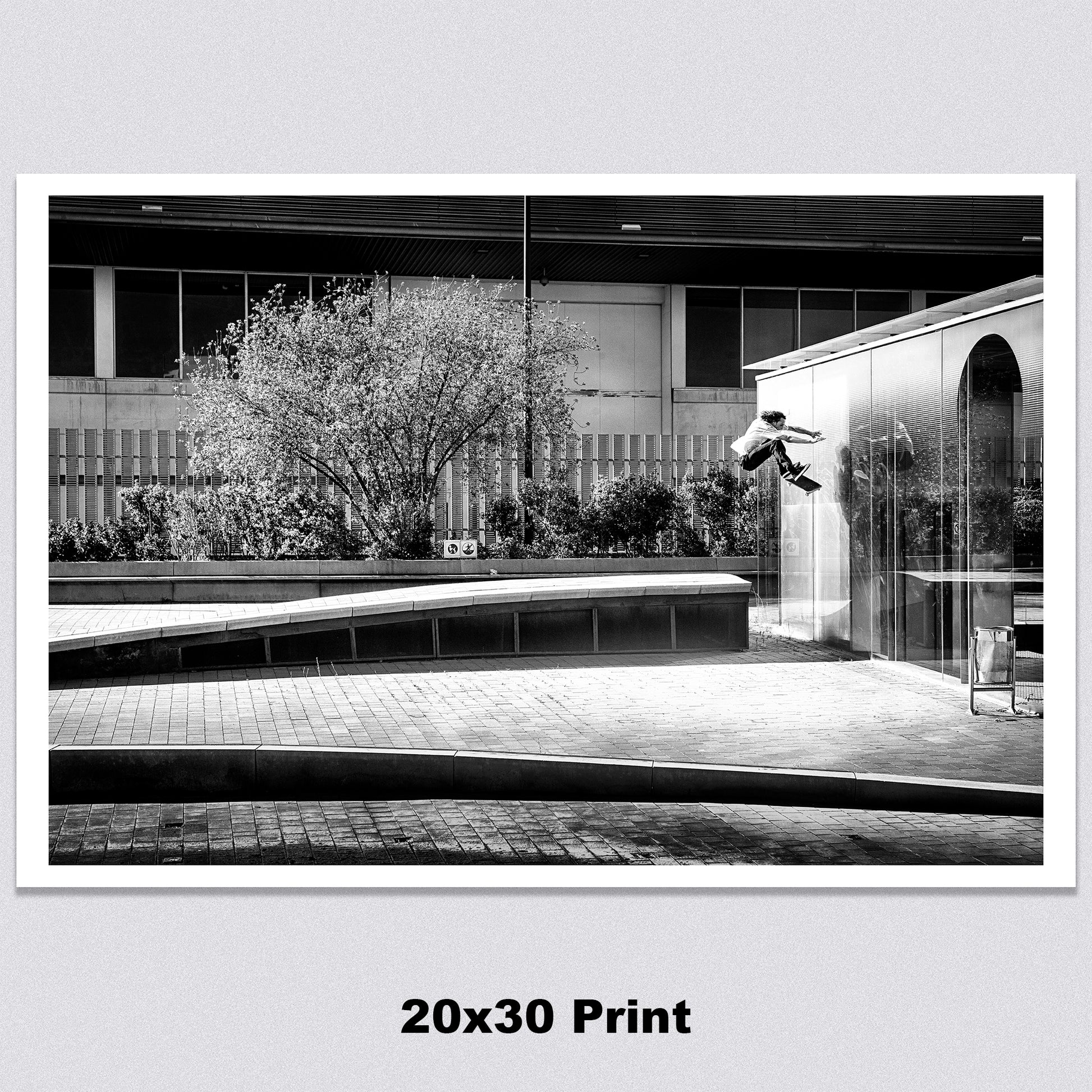 A high-quality 20x30 archival matte paper print featuring a black-and-white photo of Evan Smith executing a stylish kickflip wallride in Barcelona, Spain. Launching off a bump onto the wall, Evan’s creativity and effortless flow are captured in striking contrast by renowned skate photographer David Broach. Printed on premium archival matte paper for exceptional detail and longevity, making it a must-have for skateboarding enthusiasts, collectors, and fans of classic skate photography.