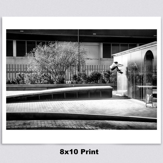 8 x 10 A high-quality archival matte paper print featuring a black-and-white photo of Evan Smith executing a stylish kickflip wallride in Barcelona, Spain. Launching off a bump onto the wall, Evan’s creativity and effortless flow are captured in striking contrast by renowned skate photographer David Broach. Printed on premium archival matte paper for exceptional detail and longevity, making it a must-have for skateboarding enthusiasts, collectors, and fans of classic skate photography.