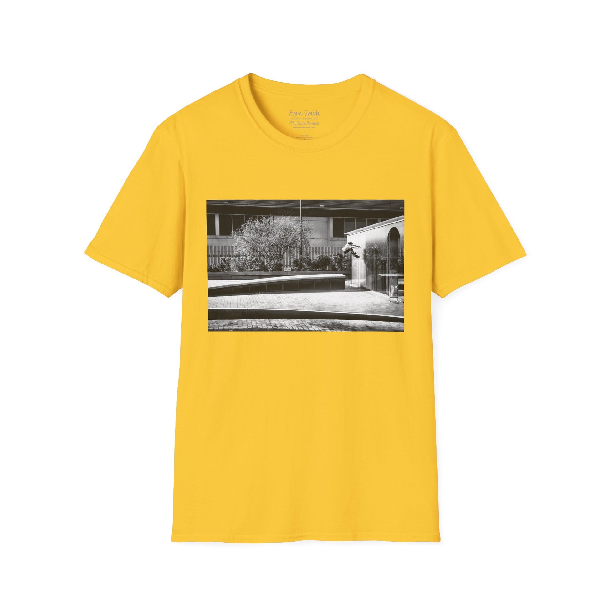 Yellow Shirt with print of Black and white photo of Evan Smith doing a kick flip wallride in Barcelona Spain. Off bump onto wall.