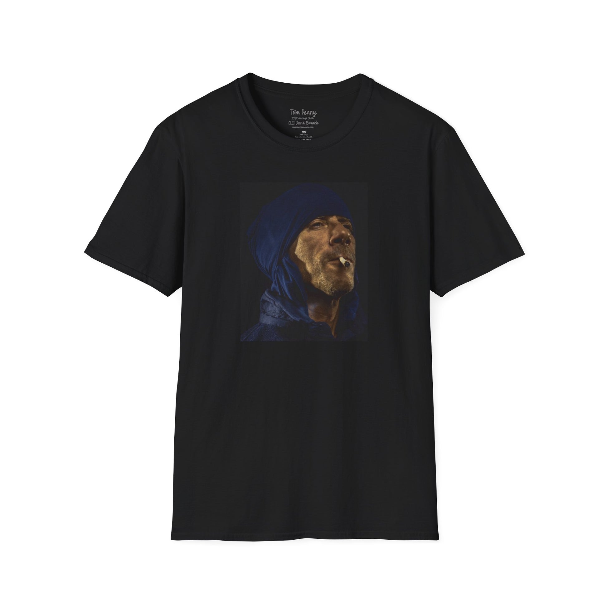 Short-sleeve black crew neck T-shirt featuring a printed portrait of legendary pro skater Tom Penny smoking a joint against a black background. Captured by photographer David Broach, the bold design highlights Penny’s effortless style and mystique, making it a must-have for skateboarding enthusiasts and streetwear fans.