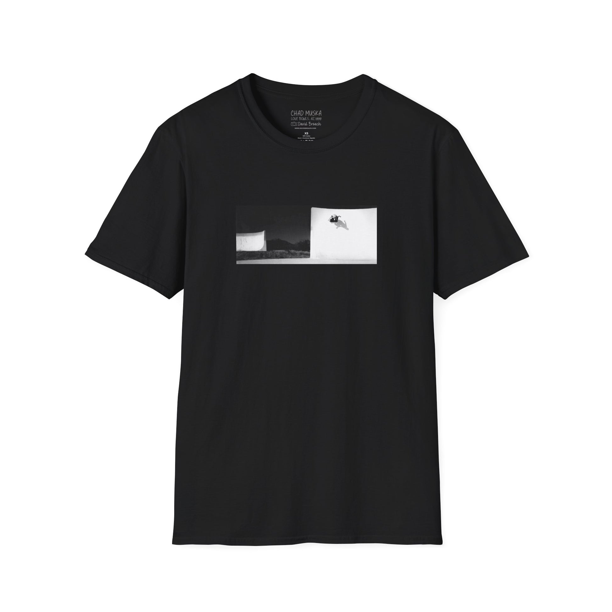 A black crew neck short-sleeve T-shirt featuring a printed photo of Chad Muska doing a massive wallride at the Love Bowls in Phoenix, Arizona, circa 2000. Captured by photographer David Broach, the design highlights Muska’s raw power and effortless style, making it a must-have for skateboarding enthusiasts and streetwear fans.