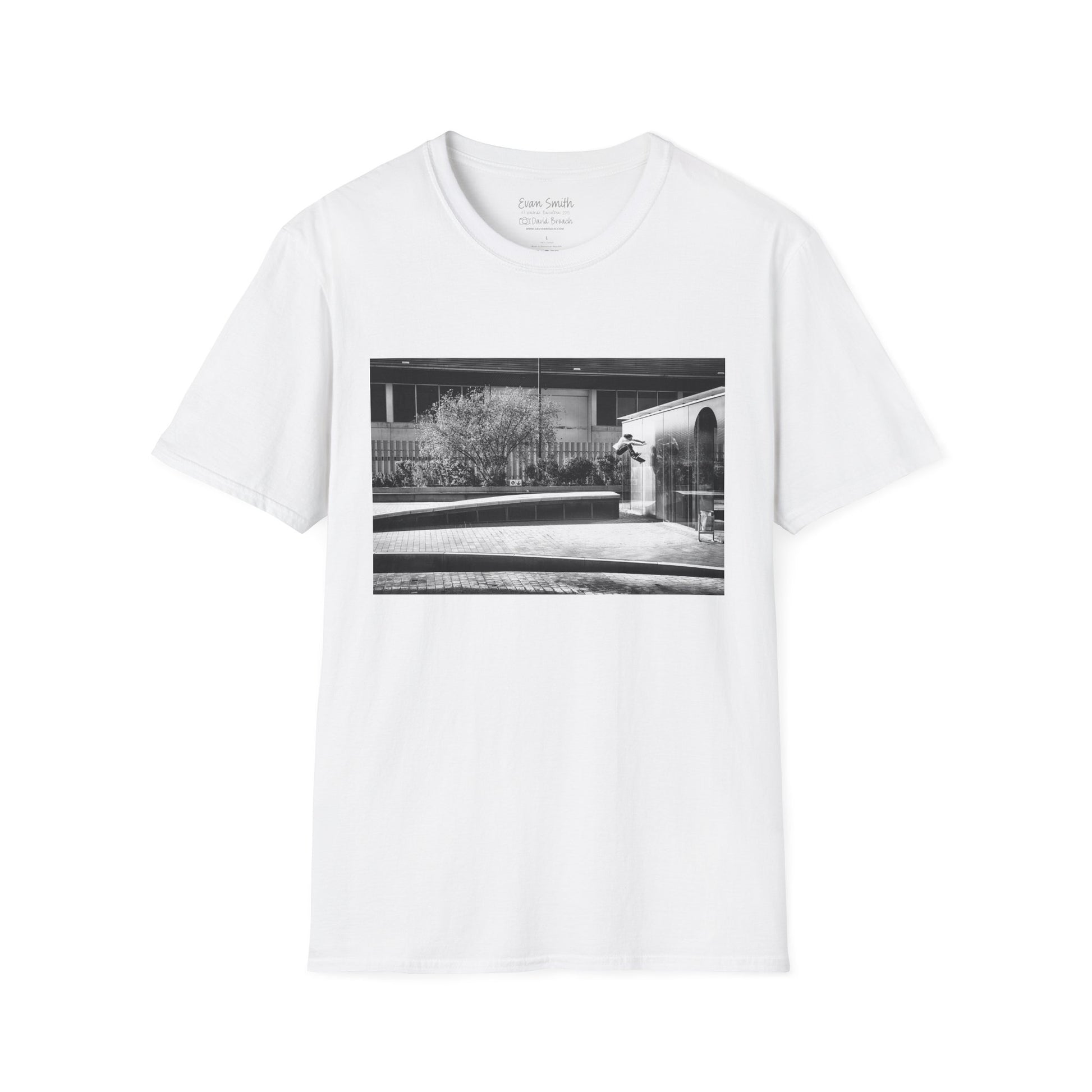 WhiteShirt with print of Black and white photo of Evan Smith doing a kick flip wallride in Barcelona Spain. Off bump onto wall.